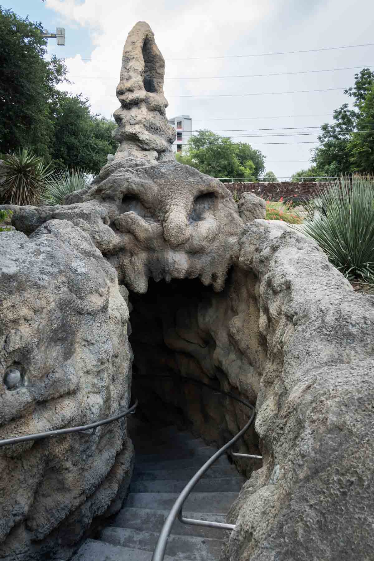 Staircase entrance into grotto sculpture along River Walk for an article on secret San Antonio photo shoot locations