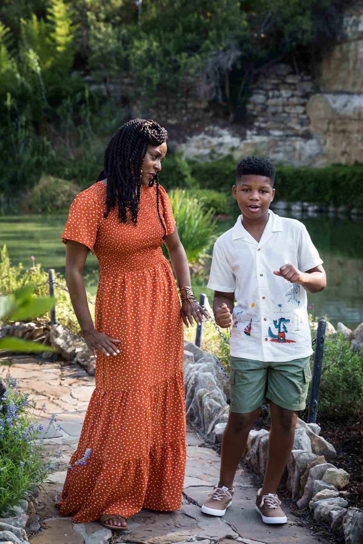 African American mother and son dancing in the San Antonio Japanese Tea Garden during a photo shoot