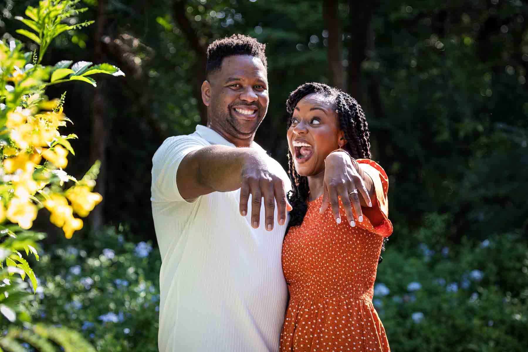 Japanese Tea Garden family portrait of an African American couple showing off her engagement ring