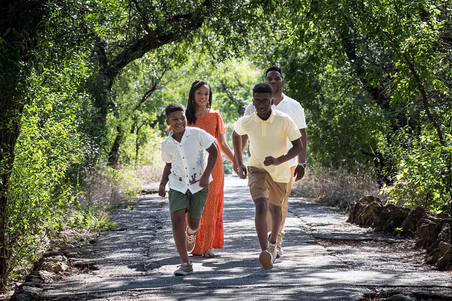 African American family walking in a forest for a Japanese Tea Garden family photo shoot