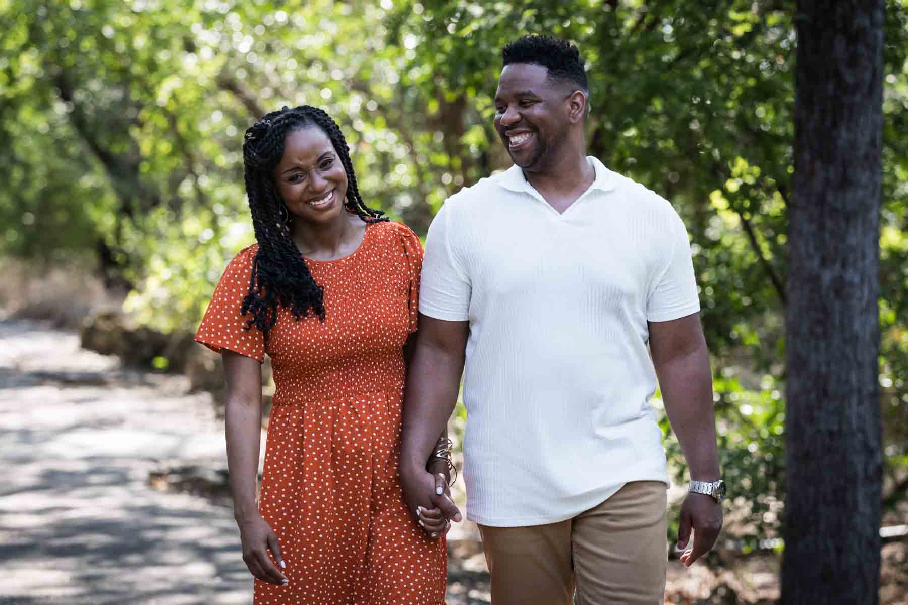 African American couple walking in a forest for a Japanese Tea Garden family photo shoot