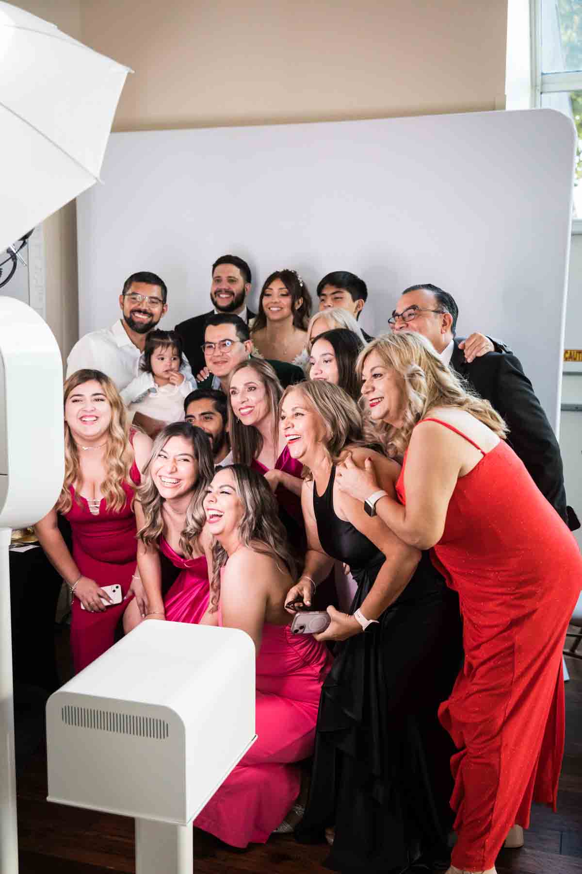 Group of guests smiling at photo booth at an Old San Francisco Steakhouse wedding