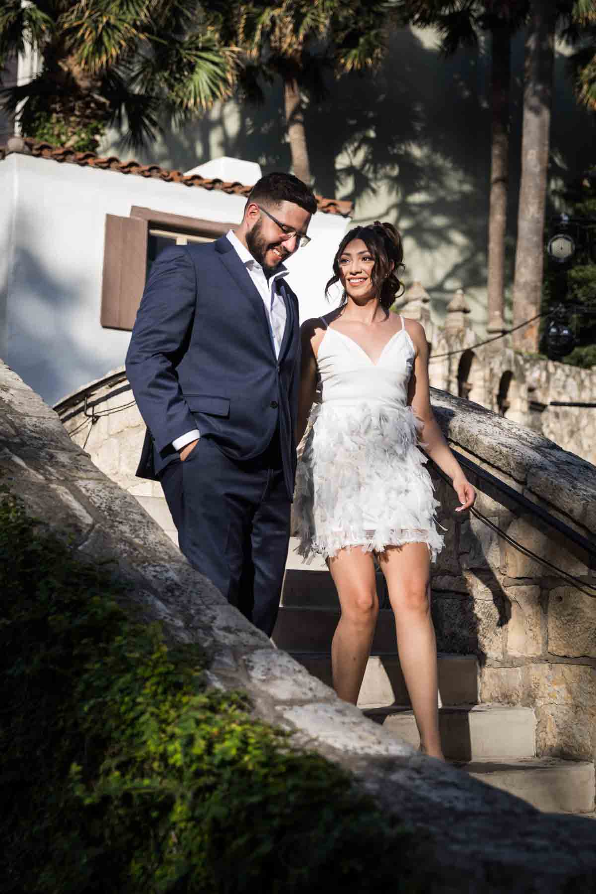 Couple walking over Rosita's Bridge along the River Walk