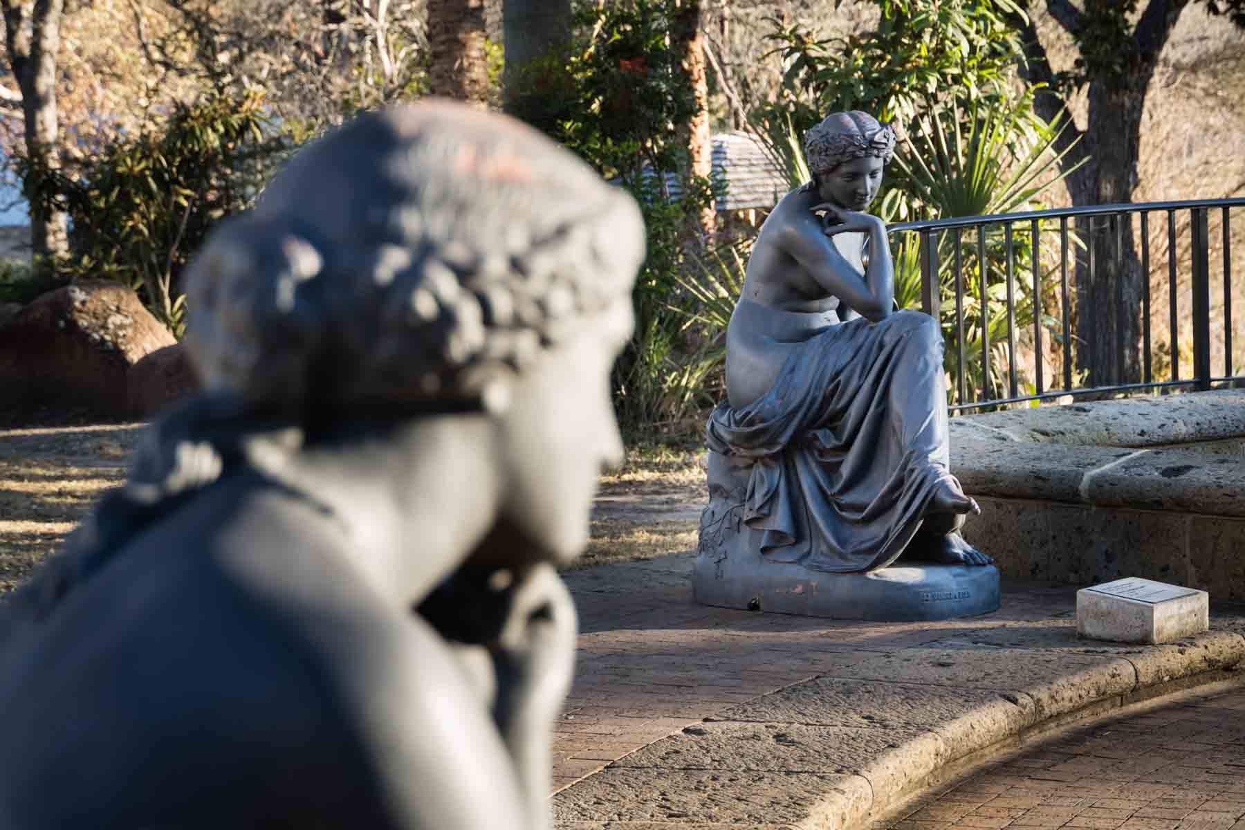 Bronze statues of two women in McNay Art Museum garden for an article listing the best places to propose in San Antonio