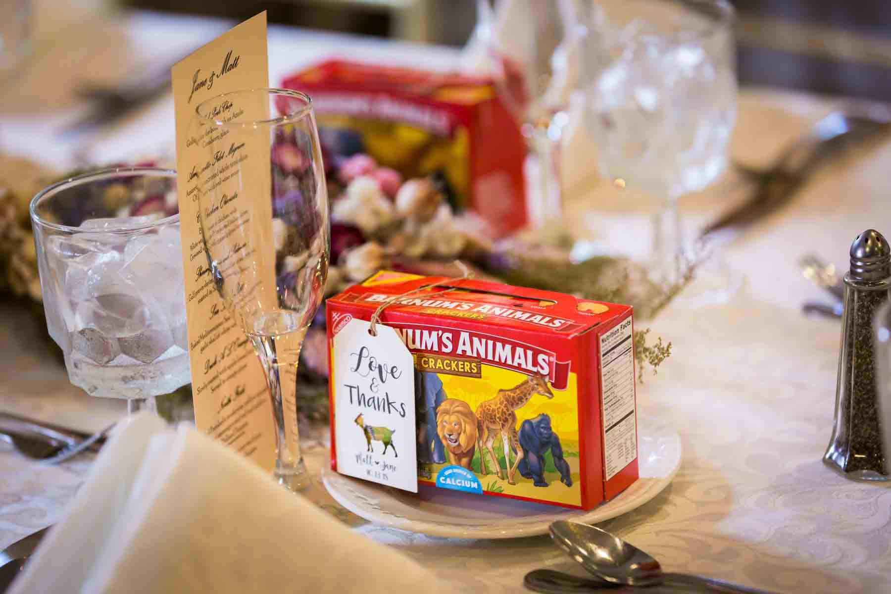 Table place setting with Barnum's Animals animal crackers as guest favors