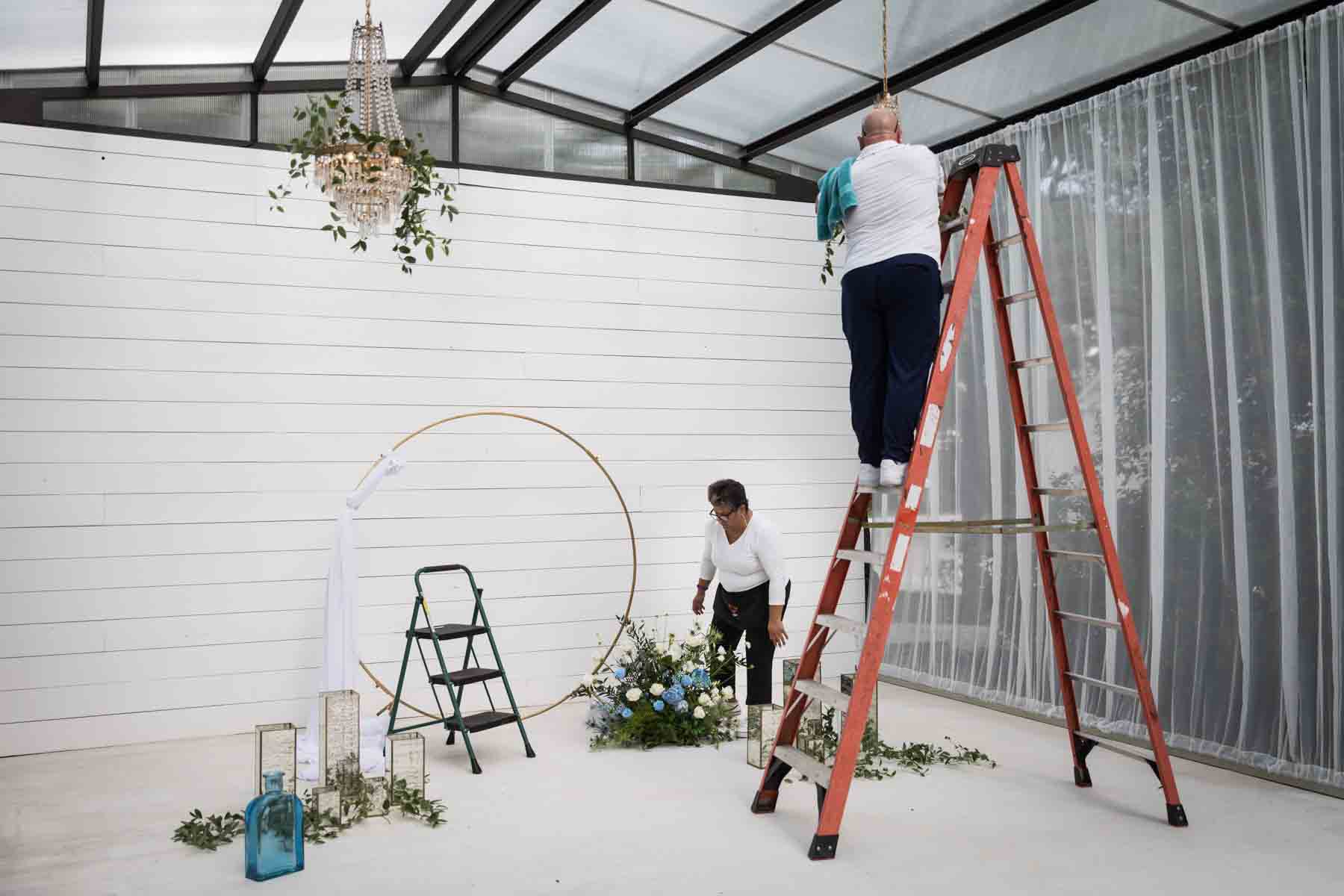 Floral team at Ay Poppy putting together wedding ceremony flower arrangement for an article on how to choose the perfect flowers for your wedding or event