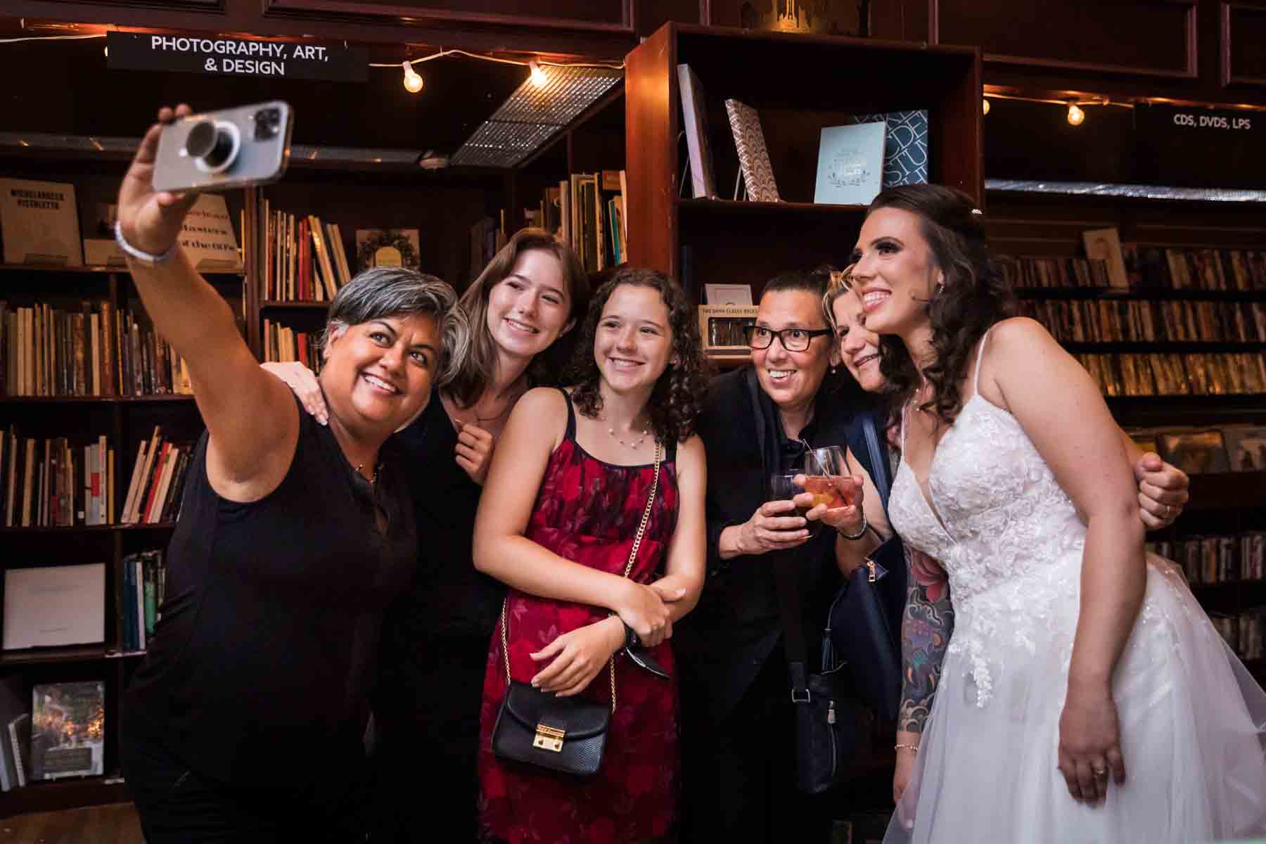 Group of guests taking a selfie at a wedding reception for an article on how to take the perfect selfie