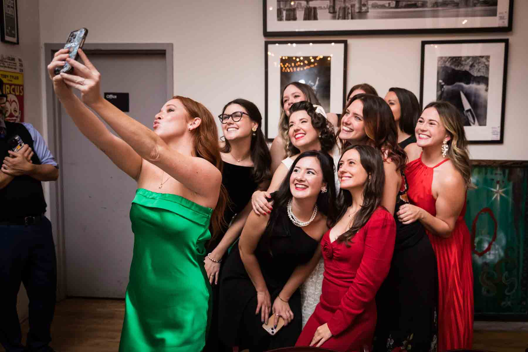 Group of guests taking a selfie at a wedding reception for an article on how to take the perfect selfie