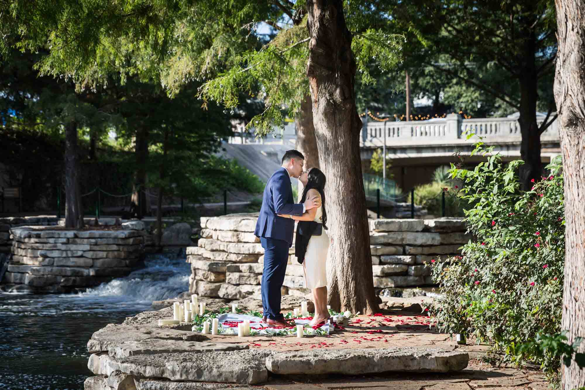 Couple holding hands on little island at Pearl Springs after proposal for an article on Pearl surprise proposal tips