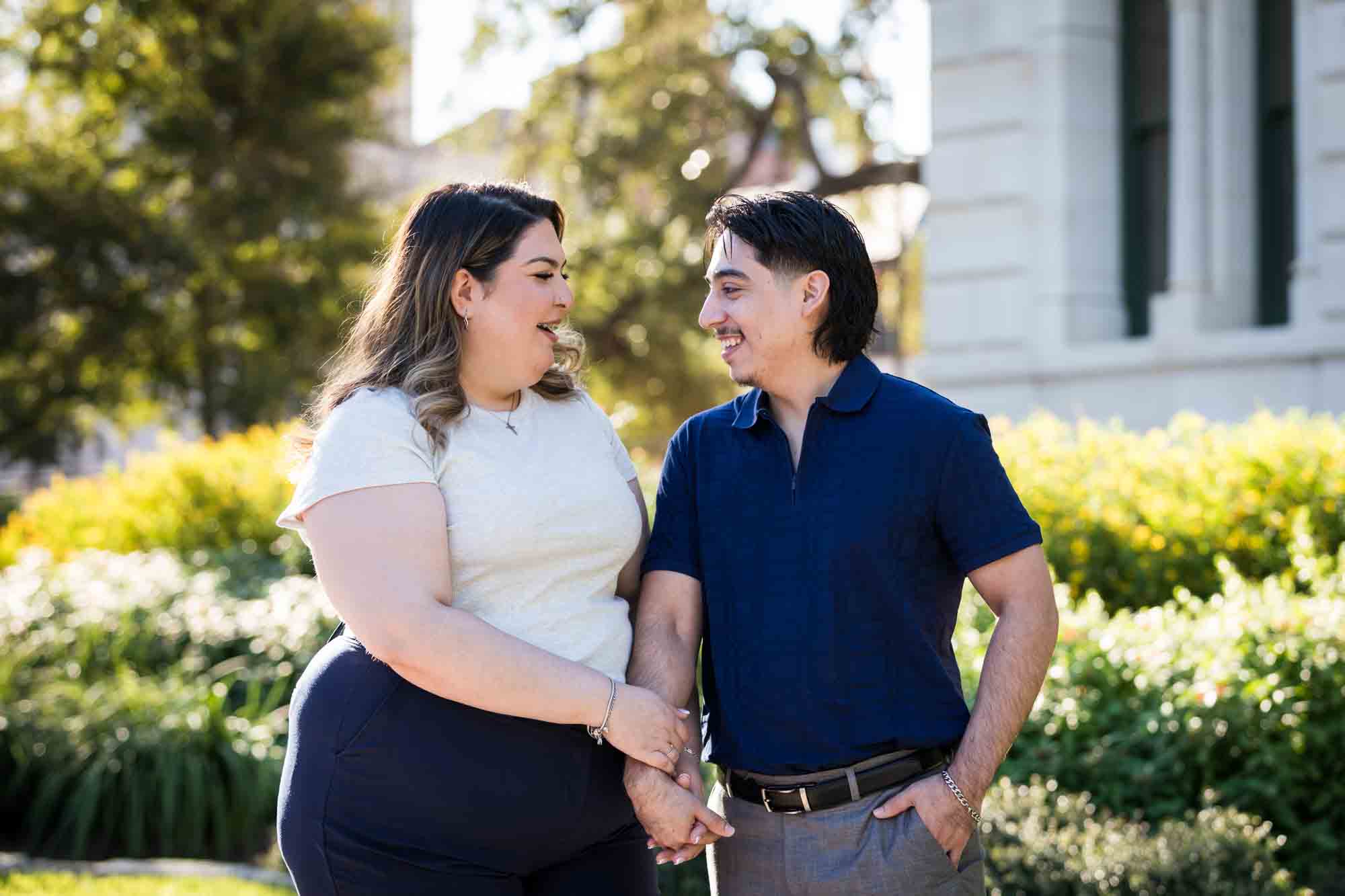 Couple standing to the side of City Hall during a downtown San Antonio photo shoot