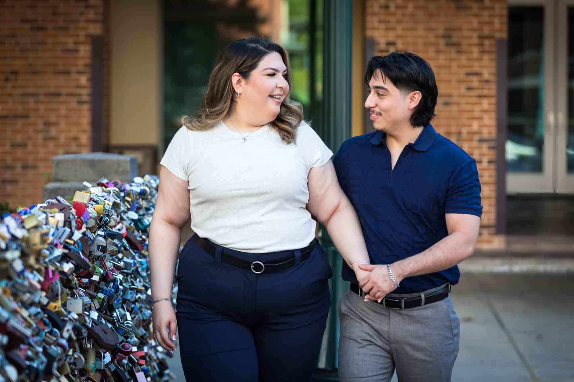 Couple walking in front of lovelock bridge during a San Antonio photo shoot