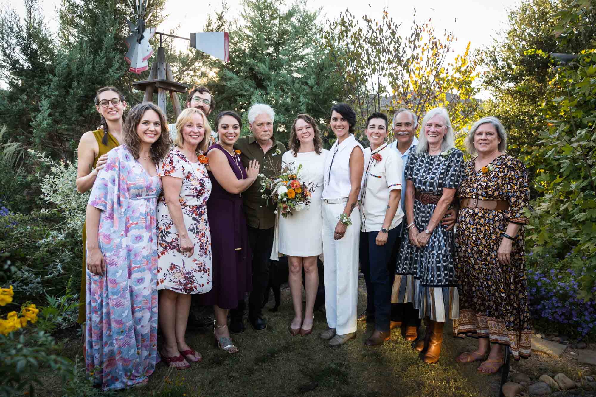 Guests lined up for a family photo at a Boerne backyard wedding