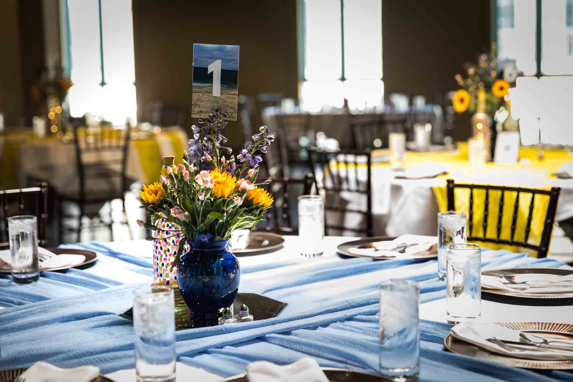 Tables filled with colorful floral centerpieces at Pat O'Brien's wedding