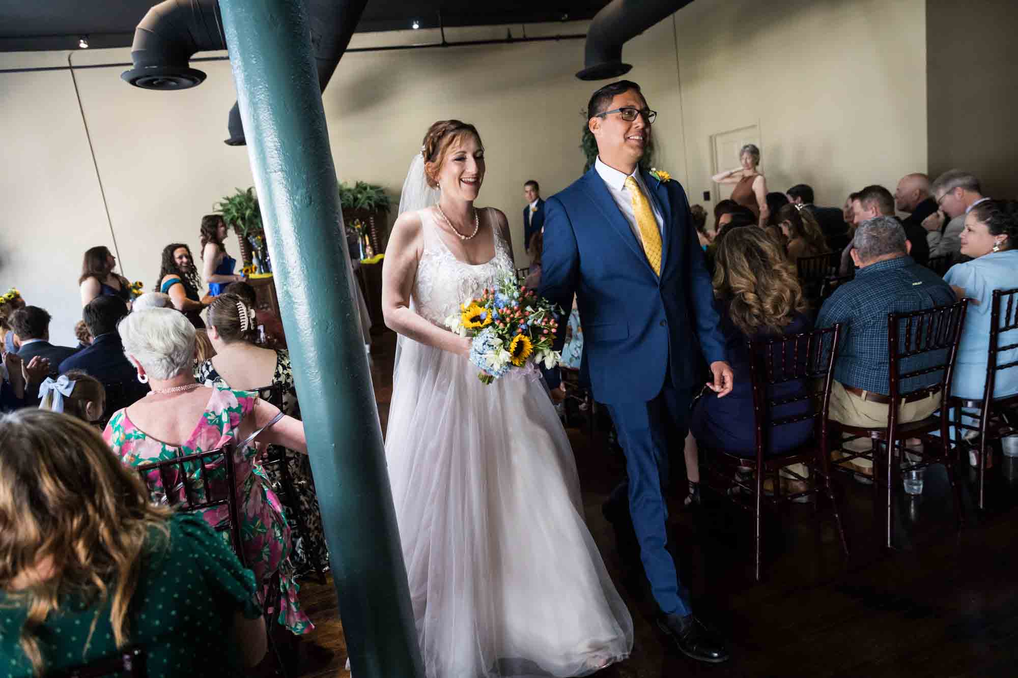 Pat O’Brien wedding photos of bride and groom walking down aisle after ceremony