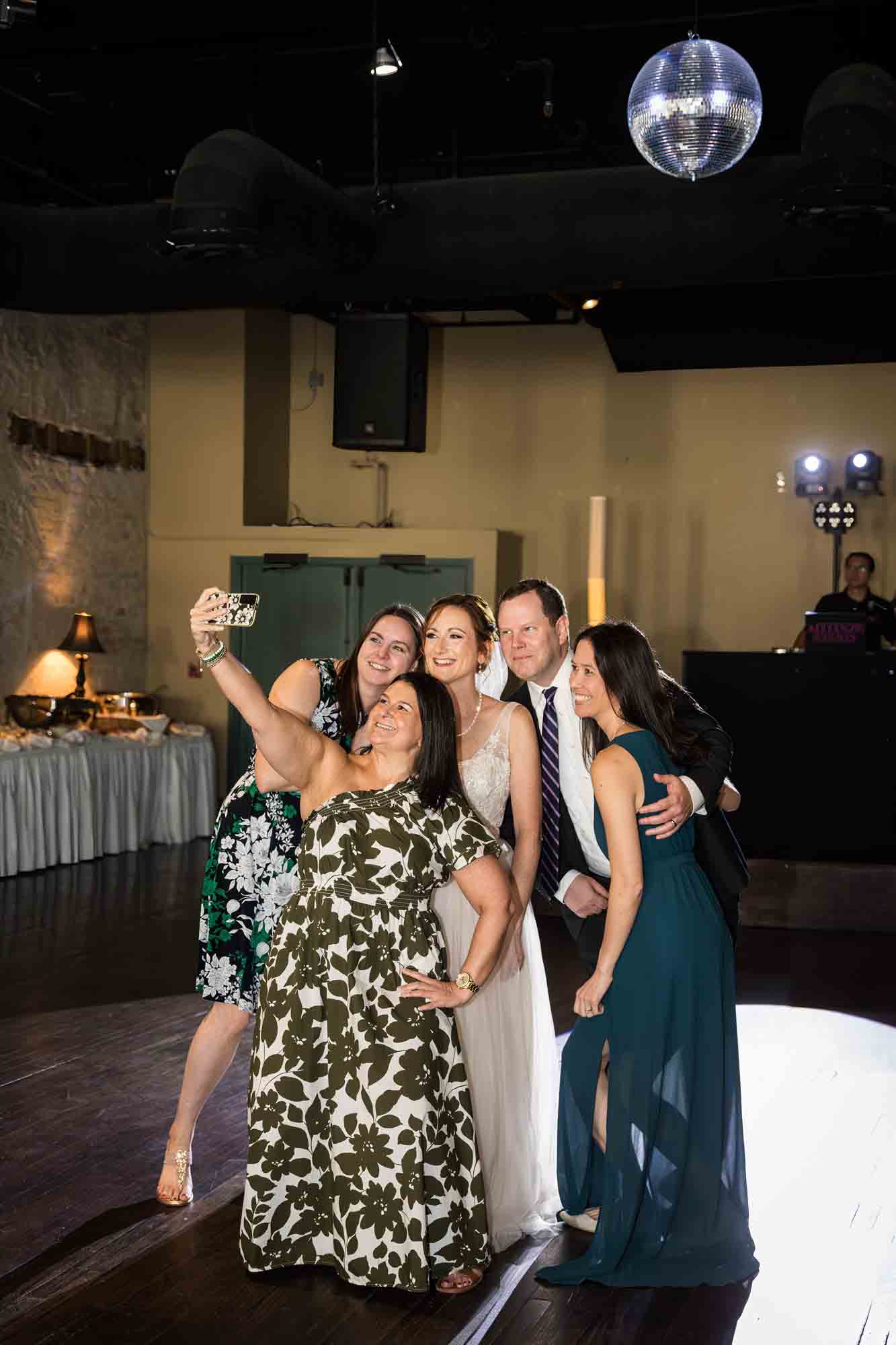 Pat O’Brien wedding photos of six guests taking a selfie during reception