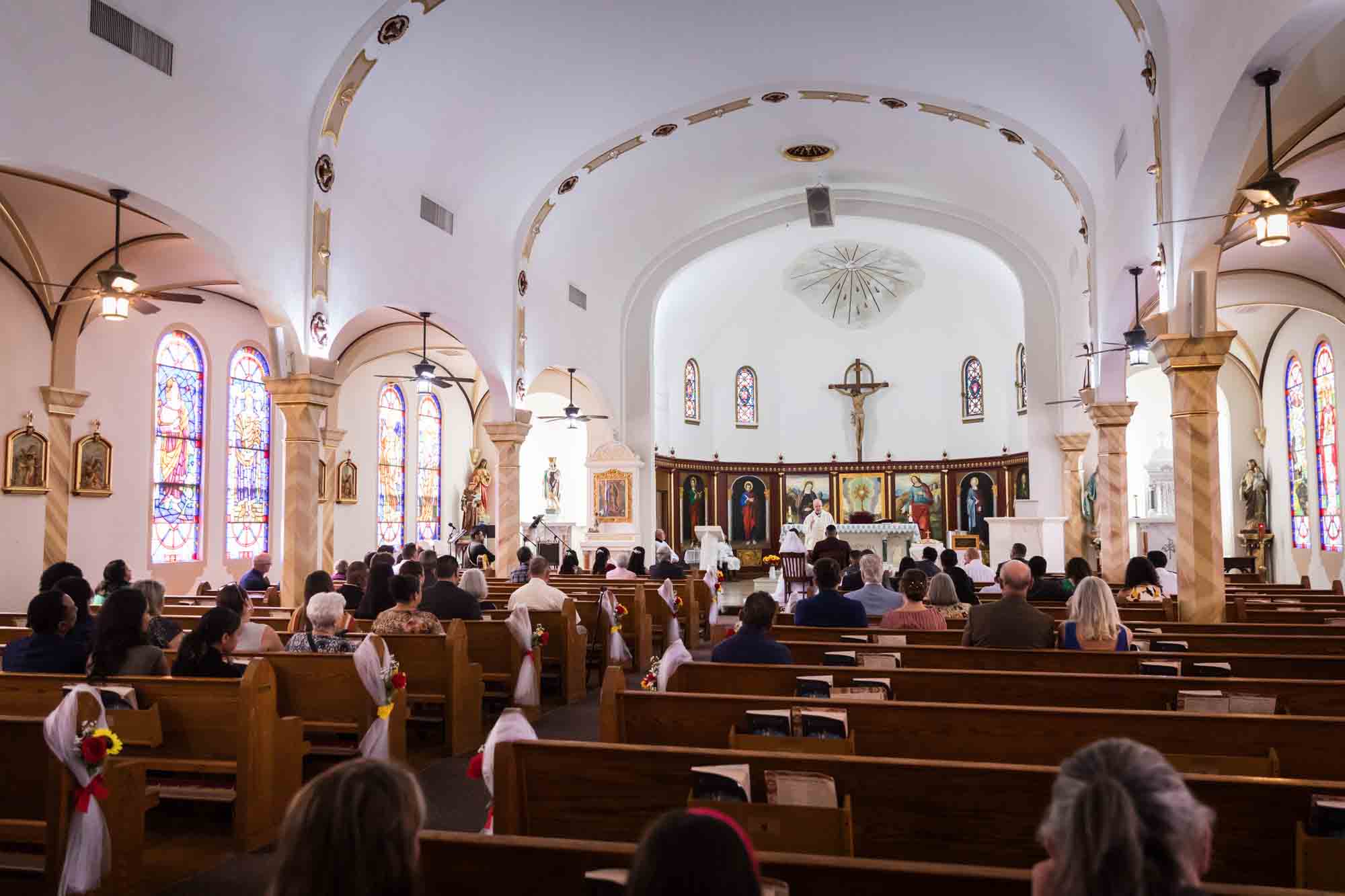 St. Henry Catholic Church wedding photos of guests watching wedding ceremony