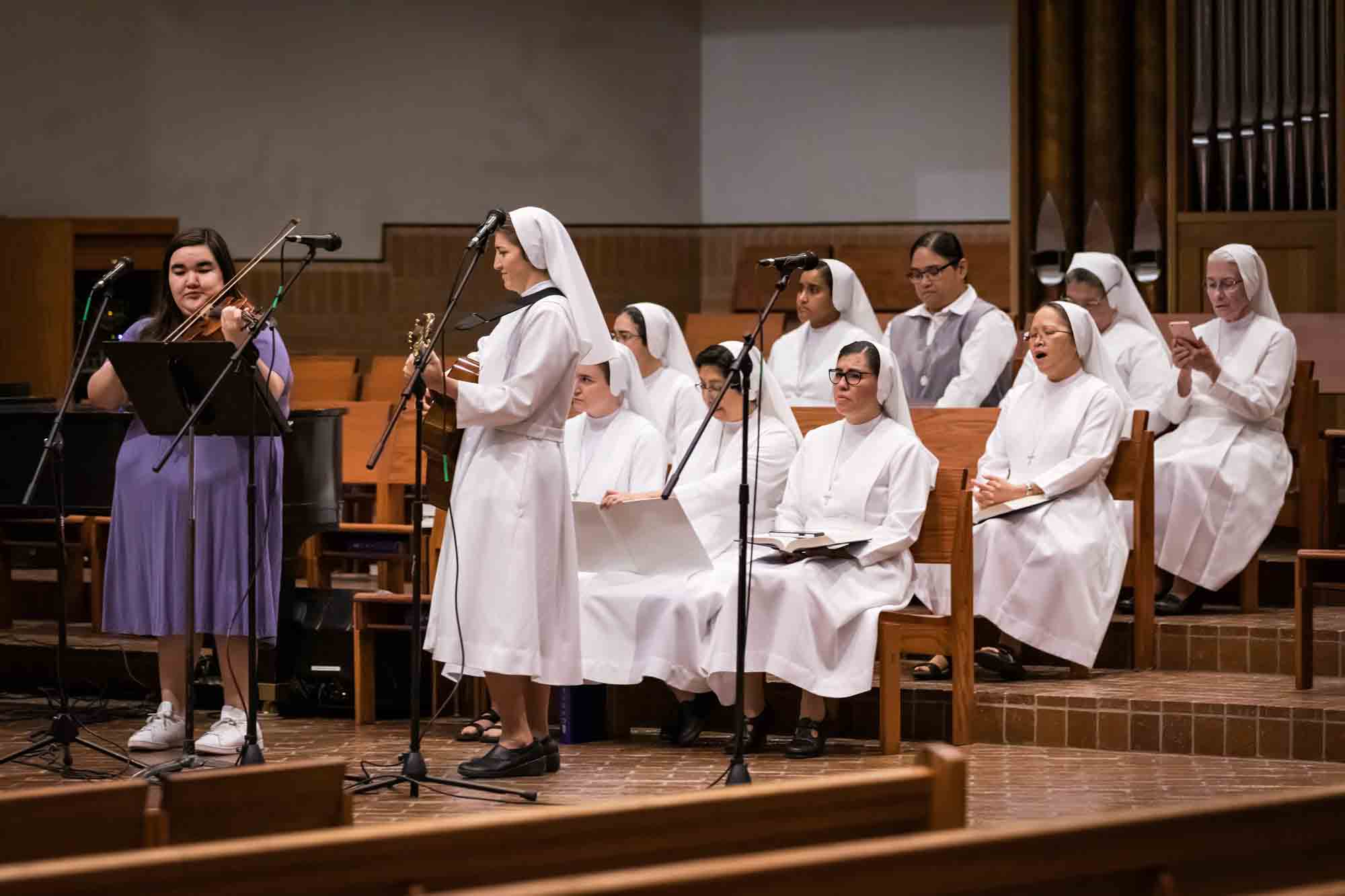 Nuns playing music and singing at a St. Mark the Evangelist Catholic Church wedding