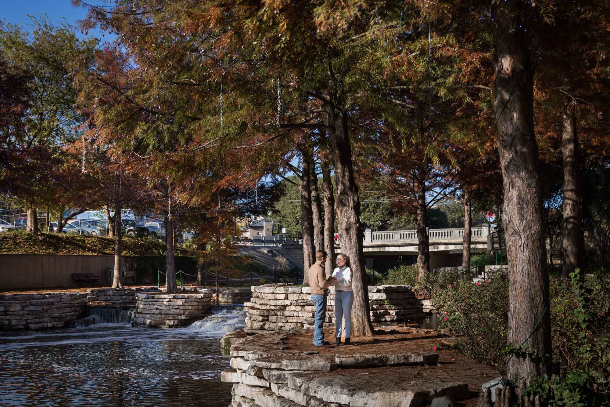 Couple standing on Pearl Springs island for an article on the importance of timing for a surprise proposal