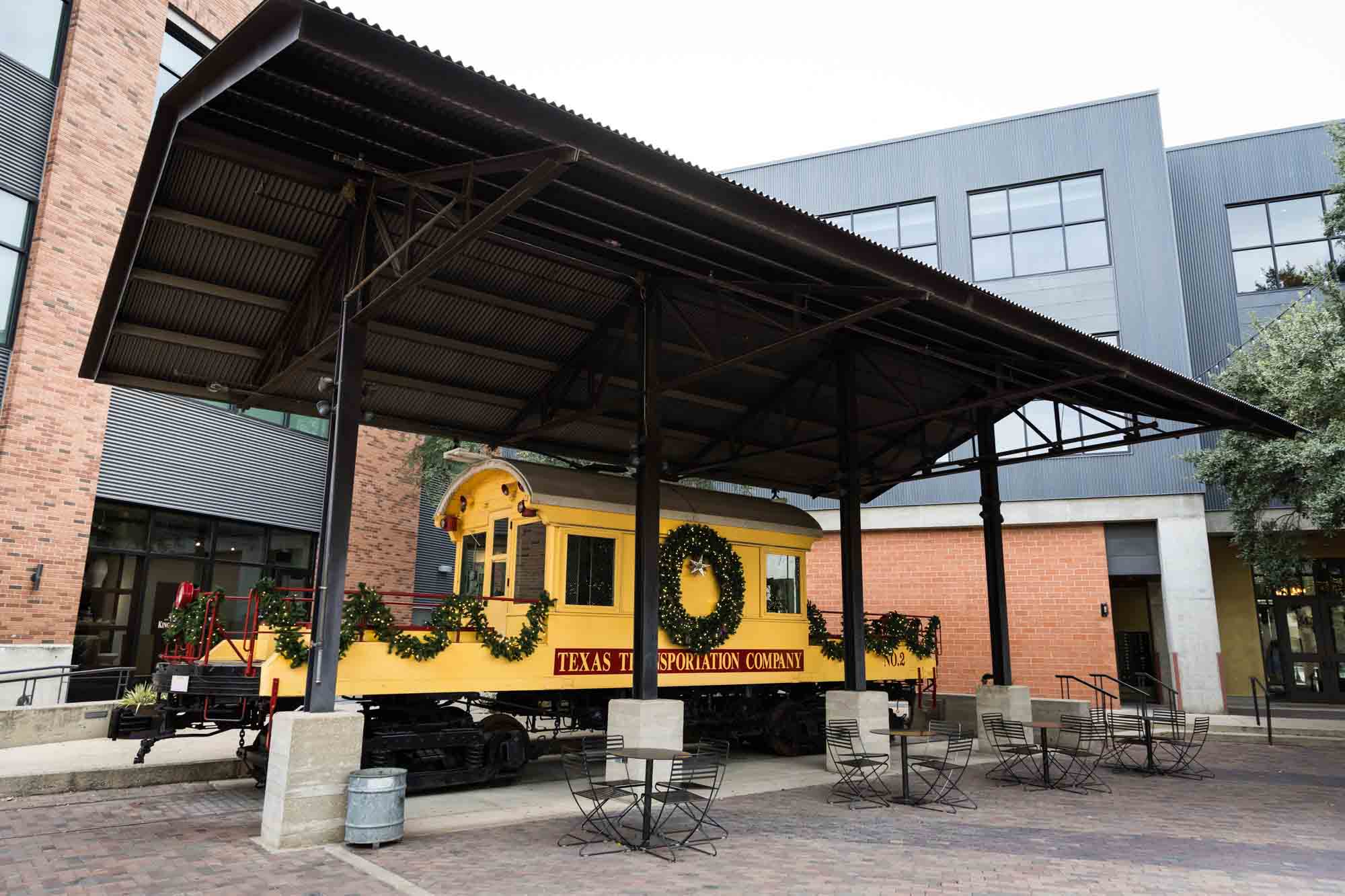 A yellow train trolley for an article on rain backup photo locations at the Pearl in San Antonio