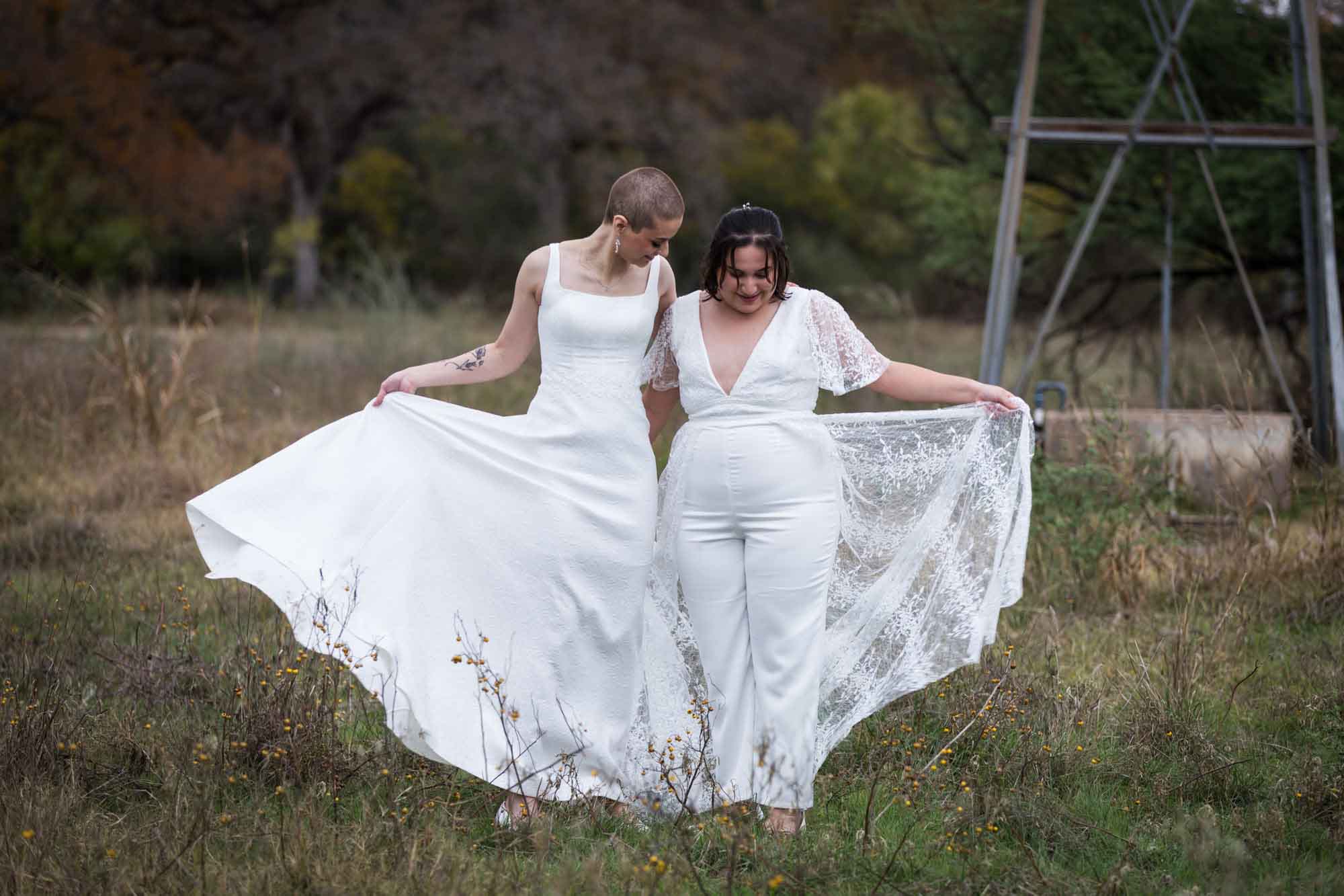 Walker Ranch Park wedding photos of two brides dressed in white dancing and playing with skirts