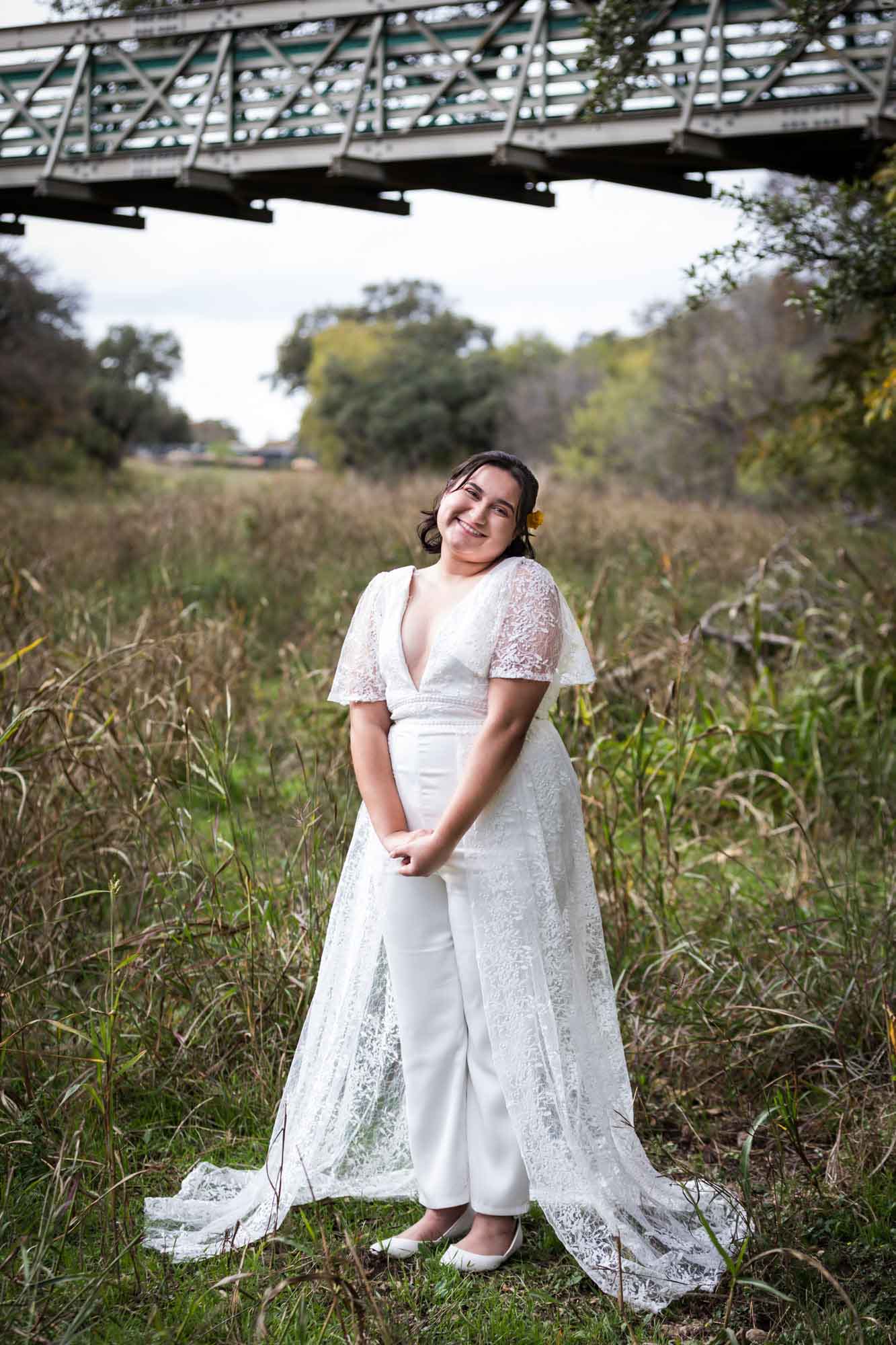 Walker Ranch Park wedding photo bride dressed in white standing in front of grass