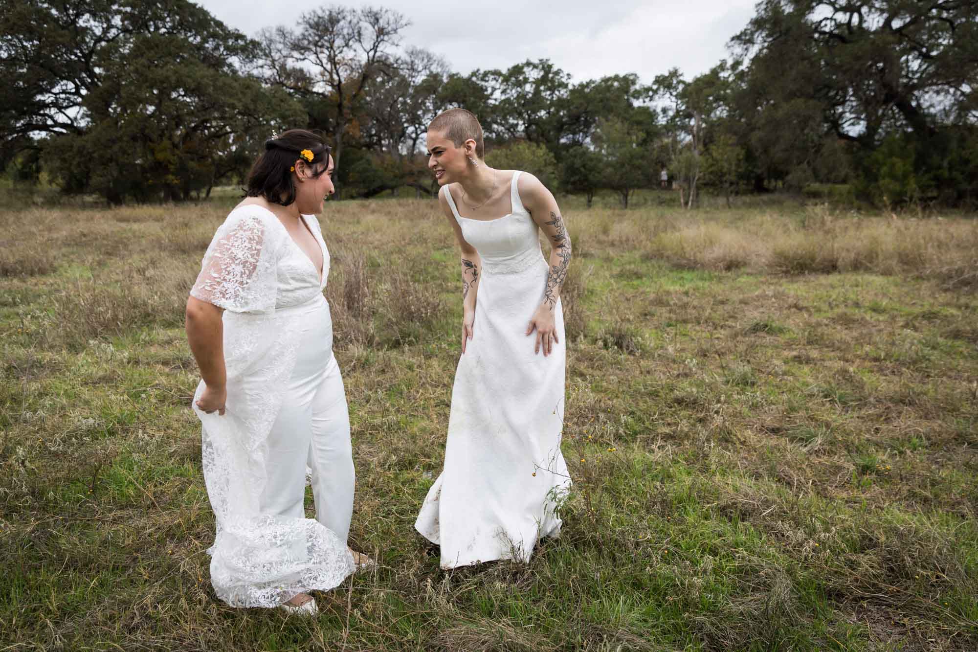 Walker Ranch Park wedding photos of two brides dressed in white standing in the grass