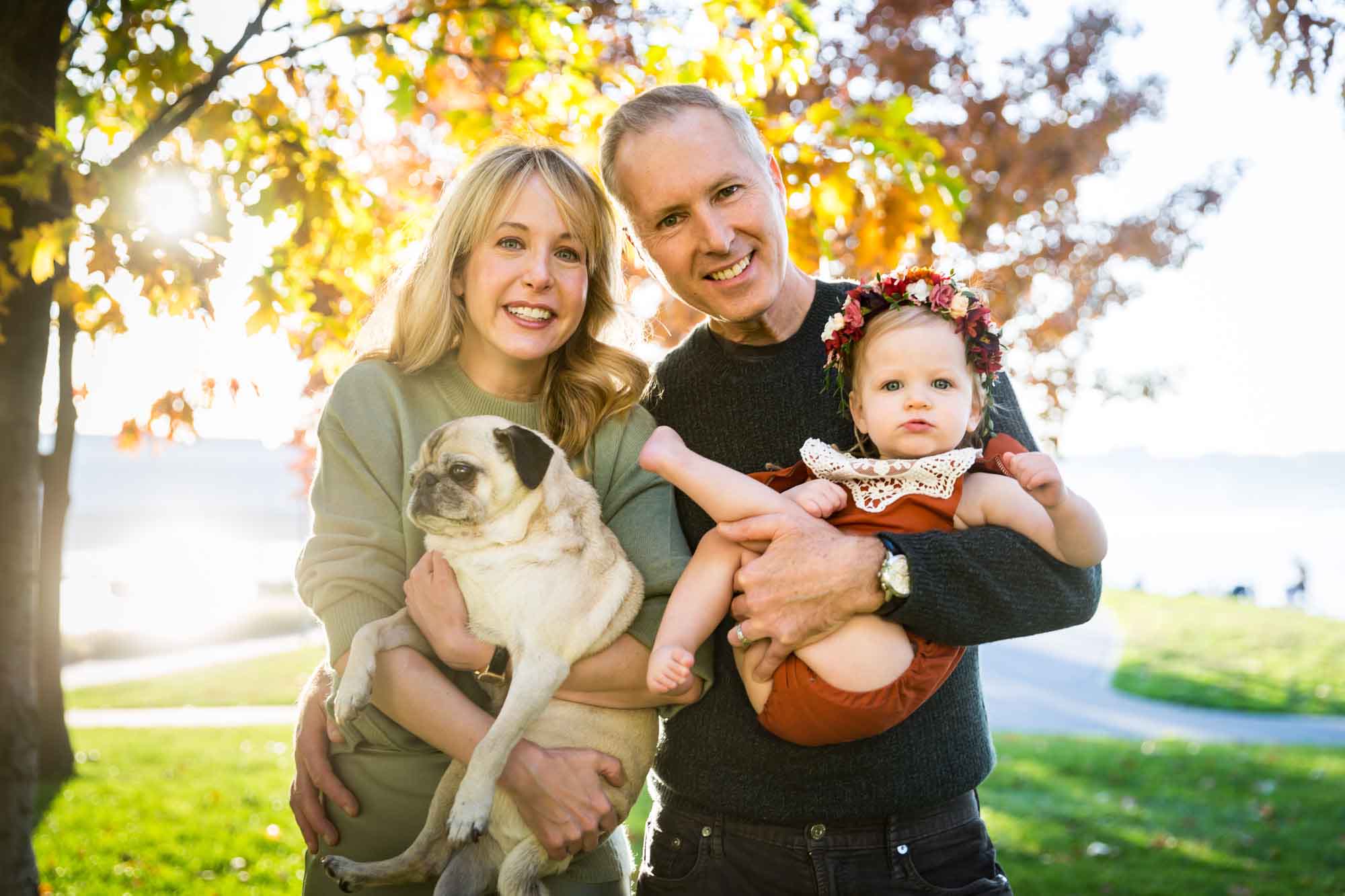 Family under golden trees for an article NYC golden hour portrait tips