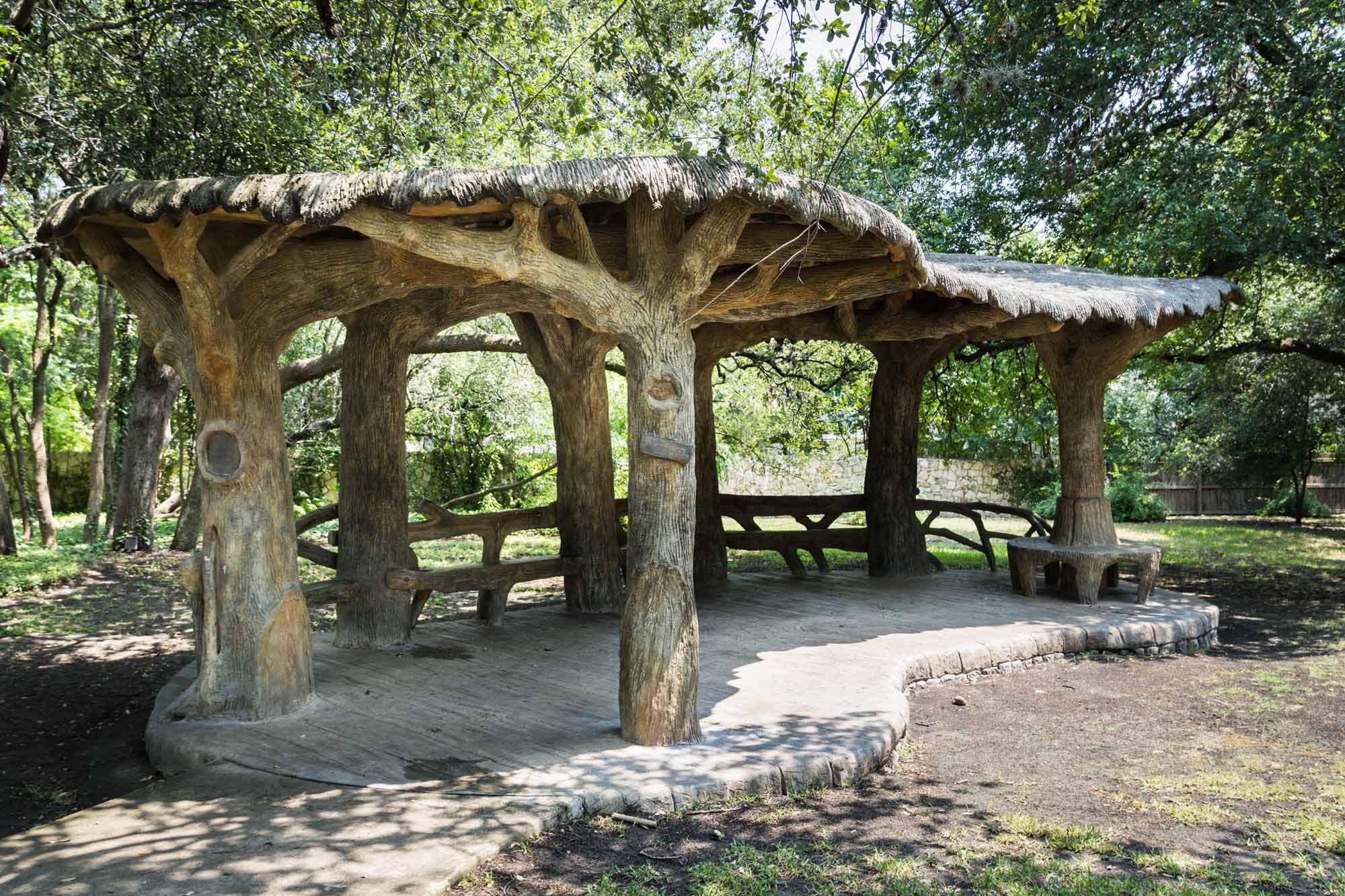 Seating area in back of Landa Library playground in the shape of a mushroom
