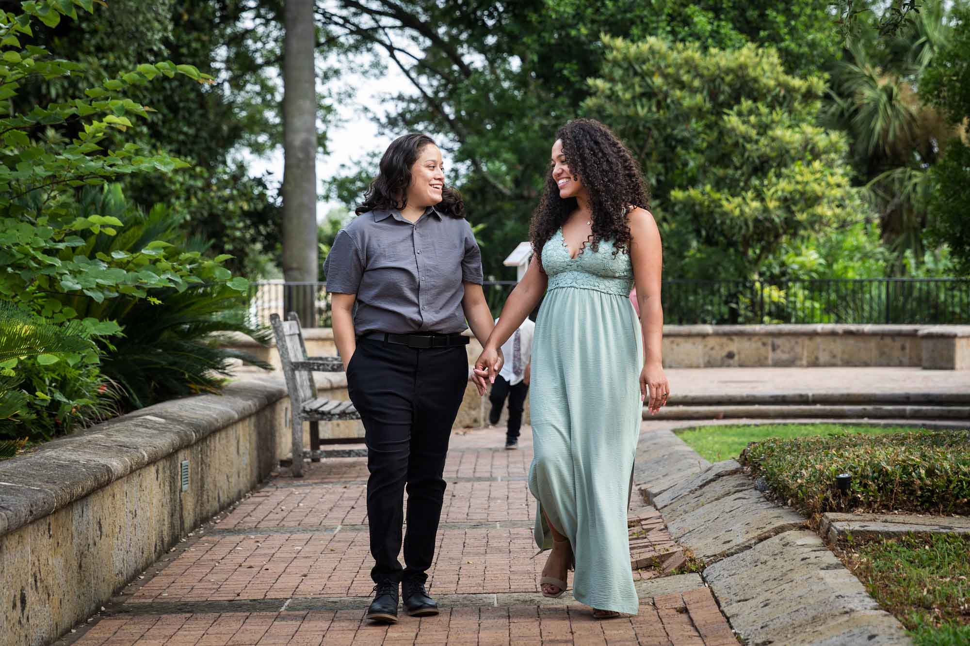 Two women holding hands walking for an article about McNay Art Museum proposal tips