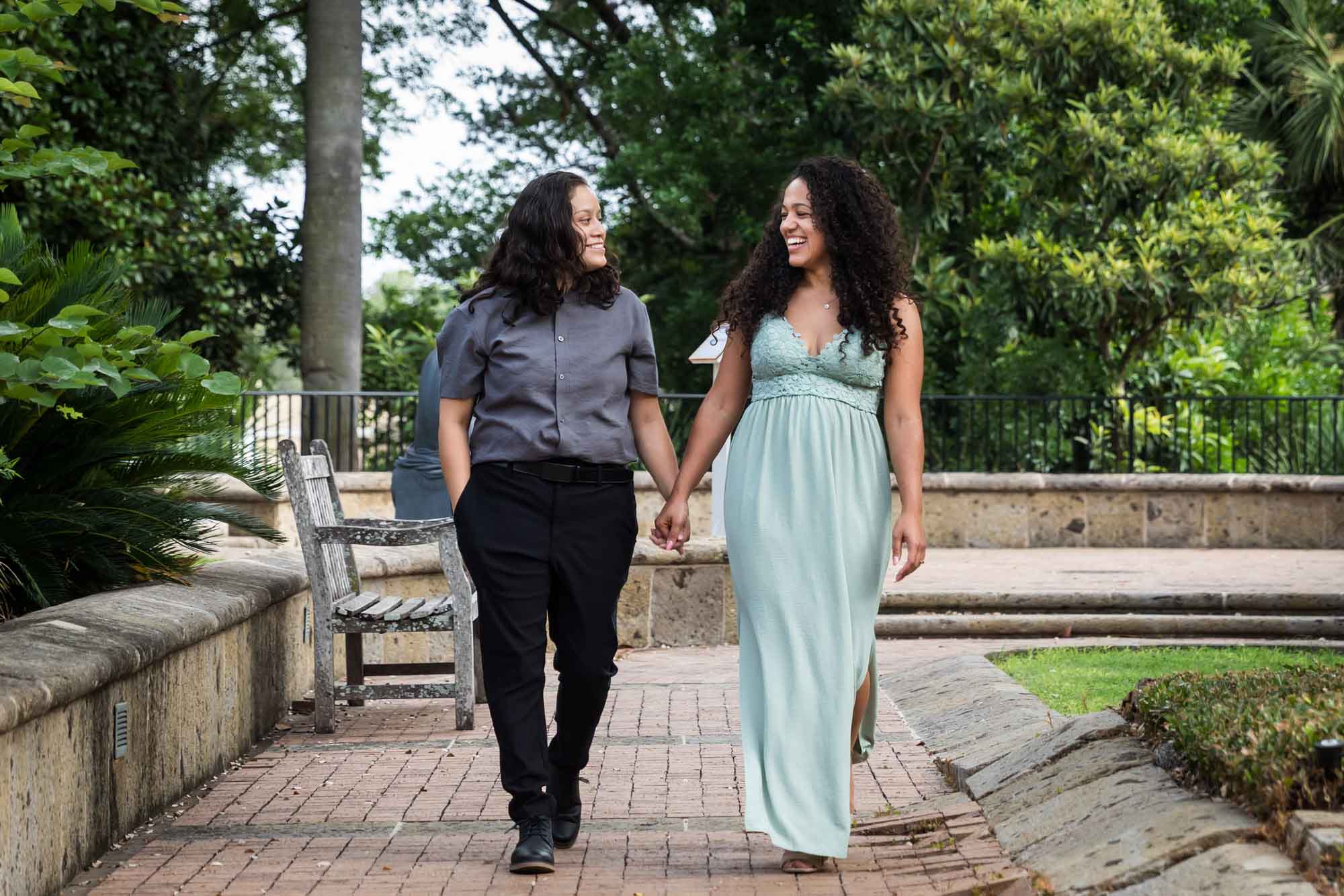 Two women walking holding hands for an article about McNay Art Museum proposal tips