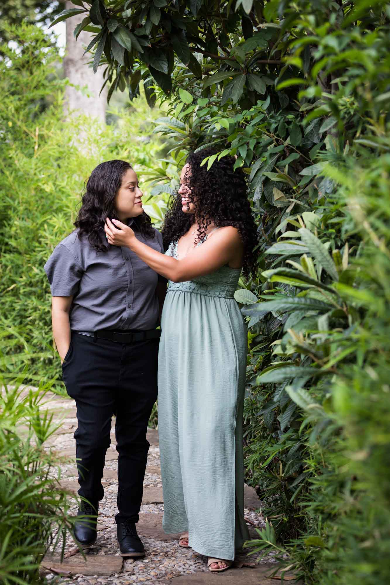 Two women walking in front of bamboo fence for an article about McNay Art Museum proposal tips