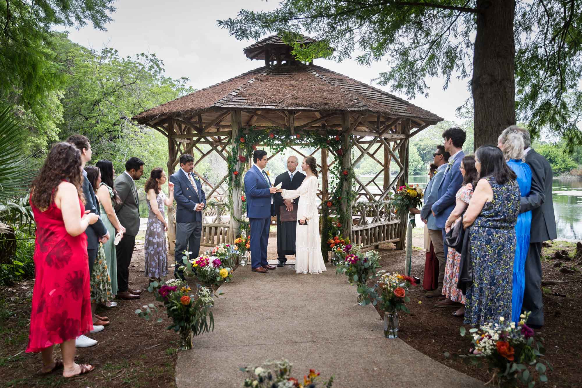 Wedding at Landa Park gazebo with bride, groom and guests for an article on affordable wedding venues in San Antonio
