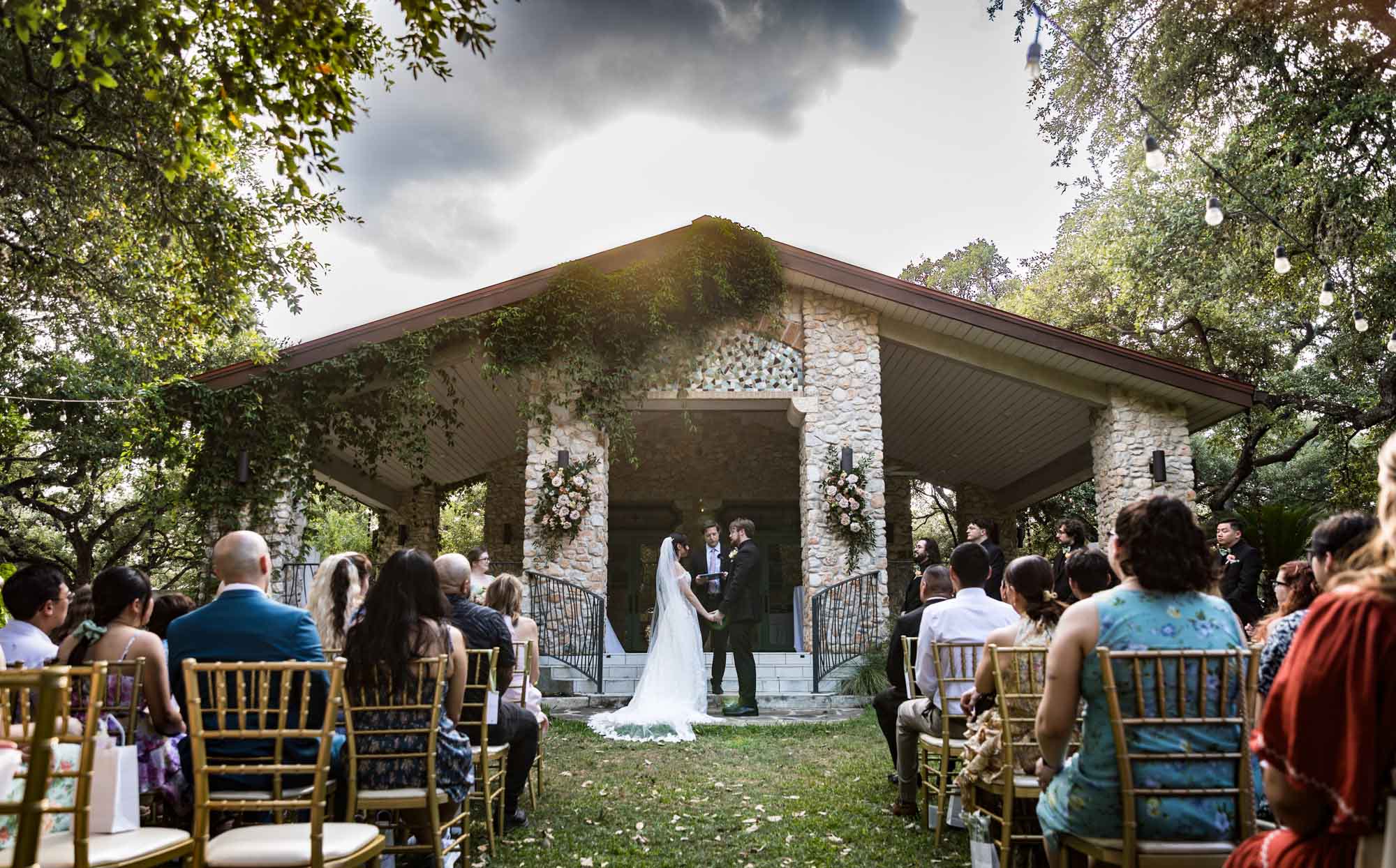 Bride and groom saying vows during ceremony at The Veranda for an article on affordable wedding venues in San Antonio