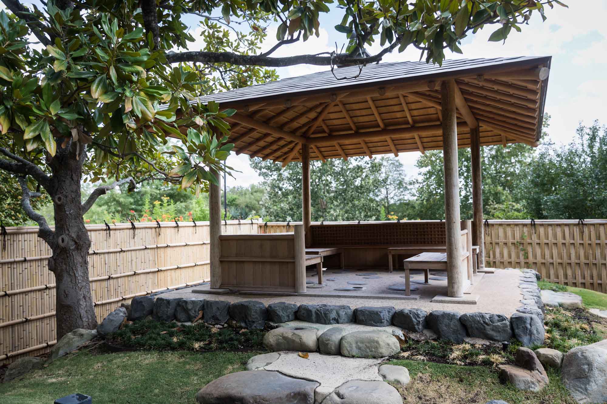 View of Kumamoto En Japanese Garden showing azumaya and trees for an article on the best San Antonio Botanical Garden photo locations