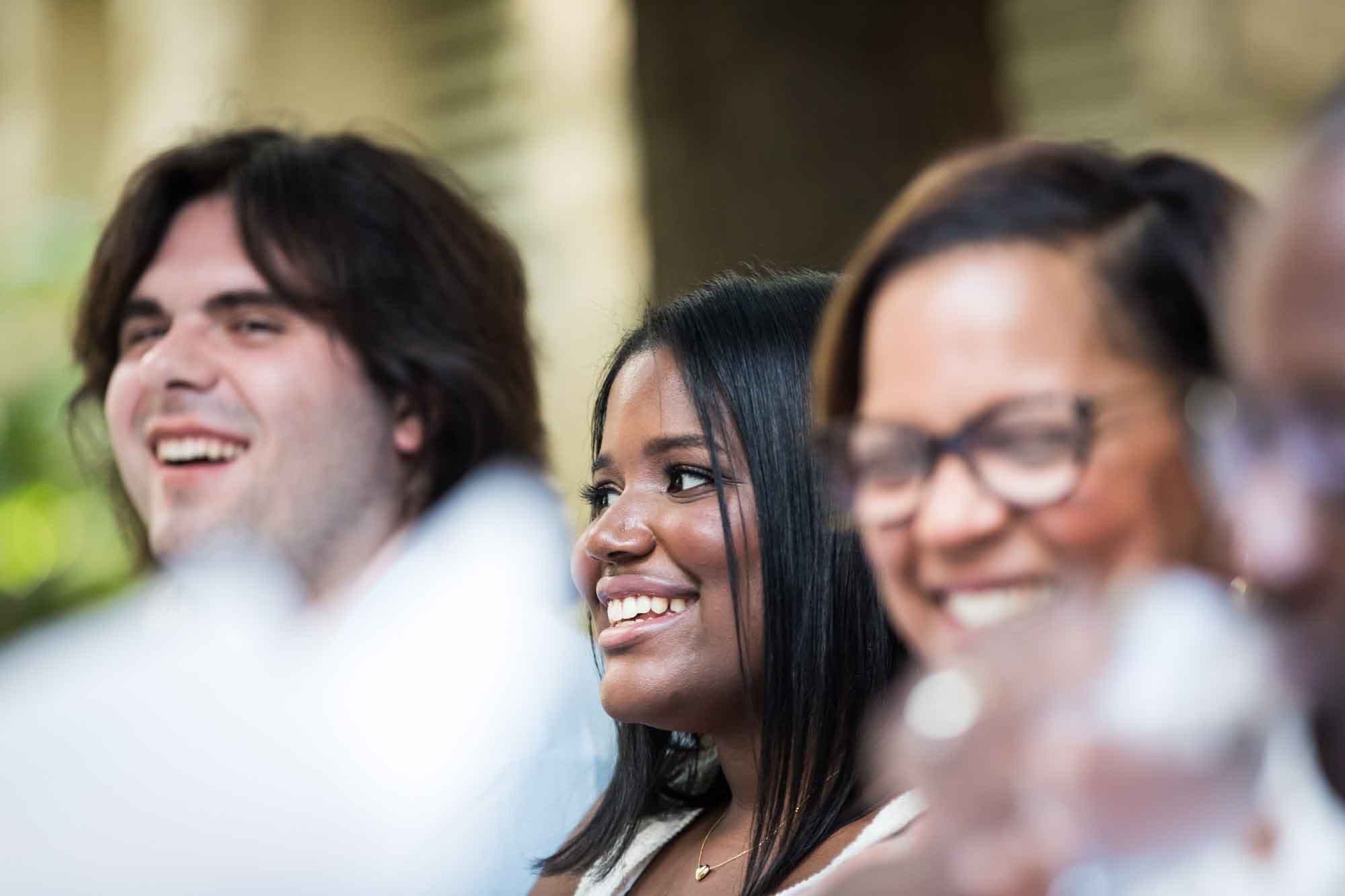 Two woman and one man laughing and smiling for an article on how to get married on a River Walk boat