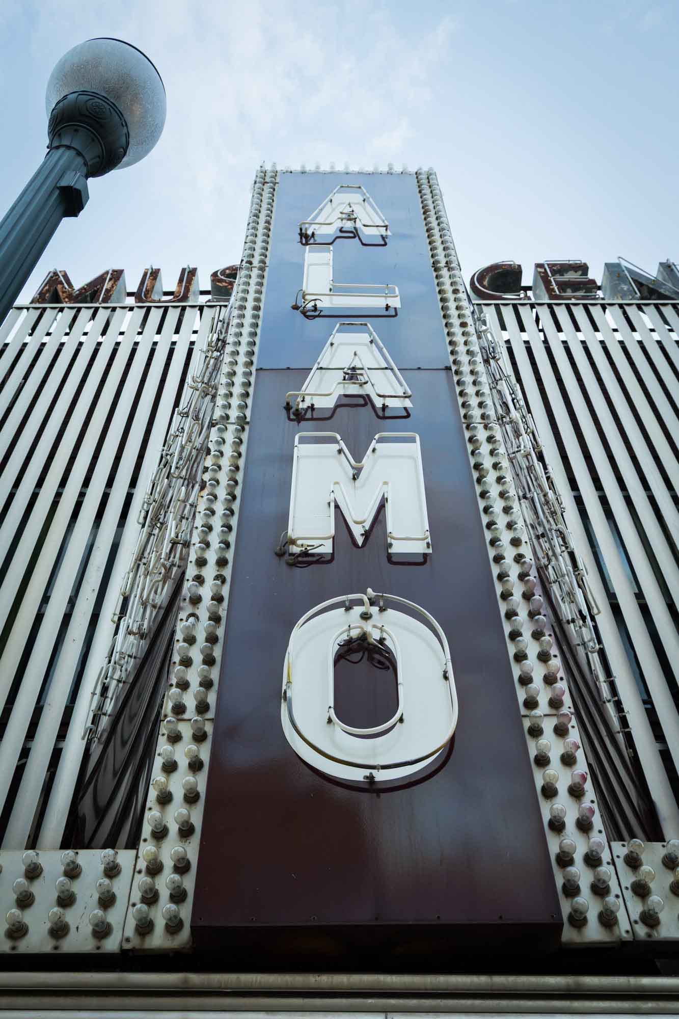 Retro neon storefront of Alamo Music Center in downtown San Antonio