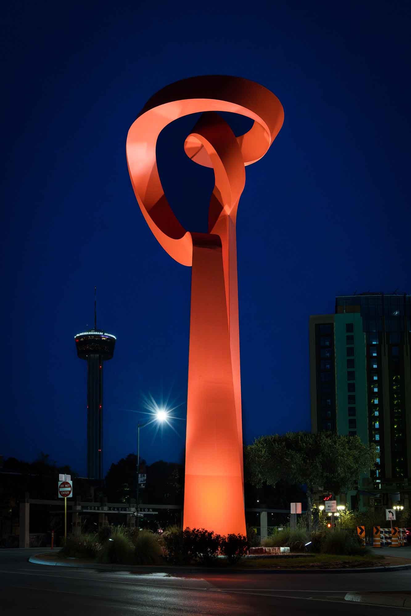 La Antorcha de la Amistad red statue at night in downtown San Antonio