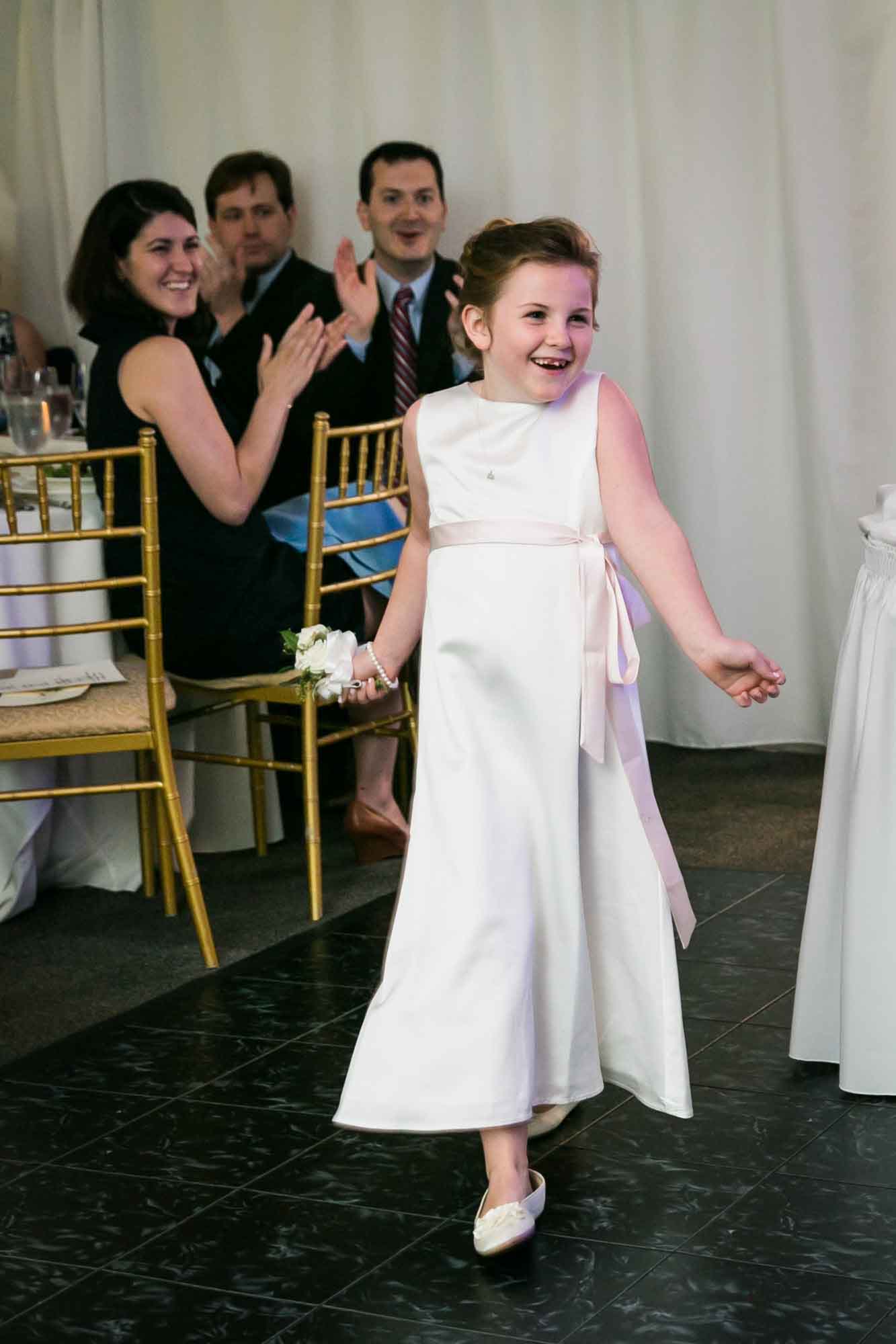 Flower girl introduction at a Pelham Bay & Split Rock Golf Club wedding reception for an article on what to have ready when the wedding photographer arrives