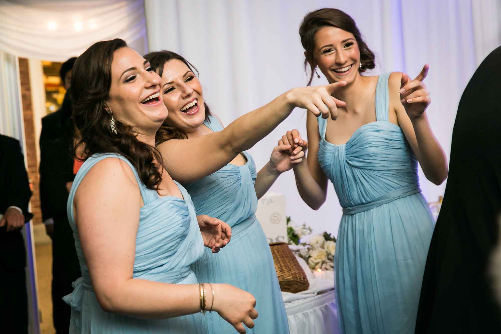 Bridesmaids at a Pelham Bay & Split Rock Golf Club wedding reception for an article on what to have ready when the wedding photographer arrives