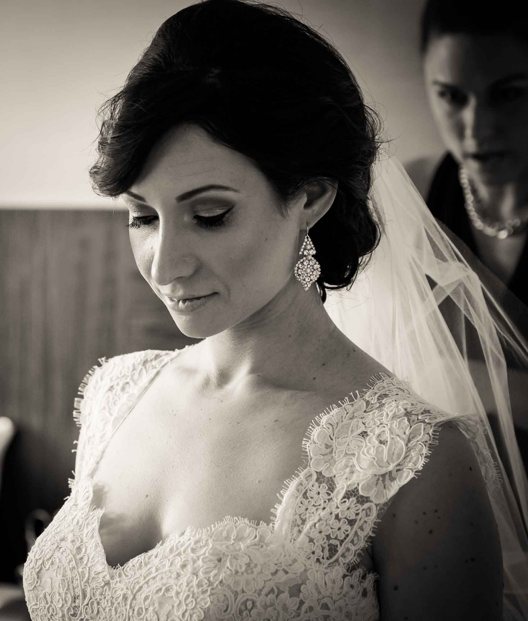 Black and white photo of bride before her Fordham University Church wedding for an article on what to have ready when the wedding photographer arrives