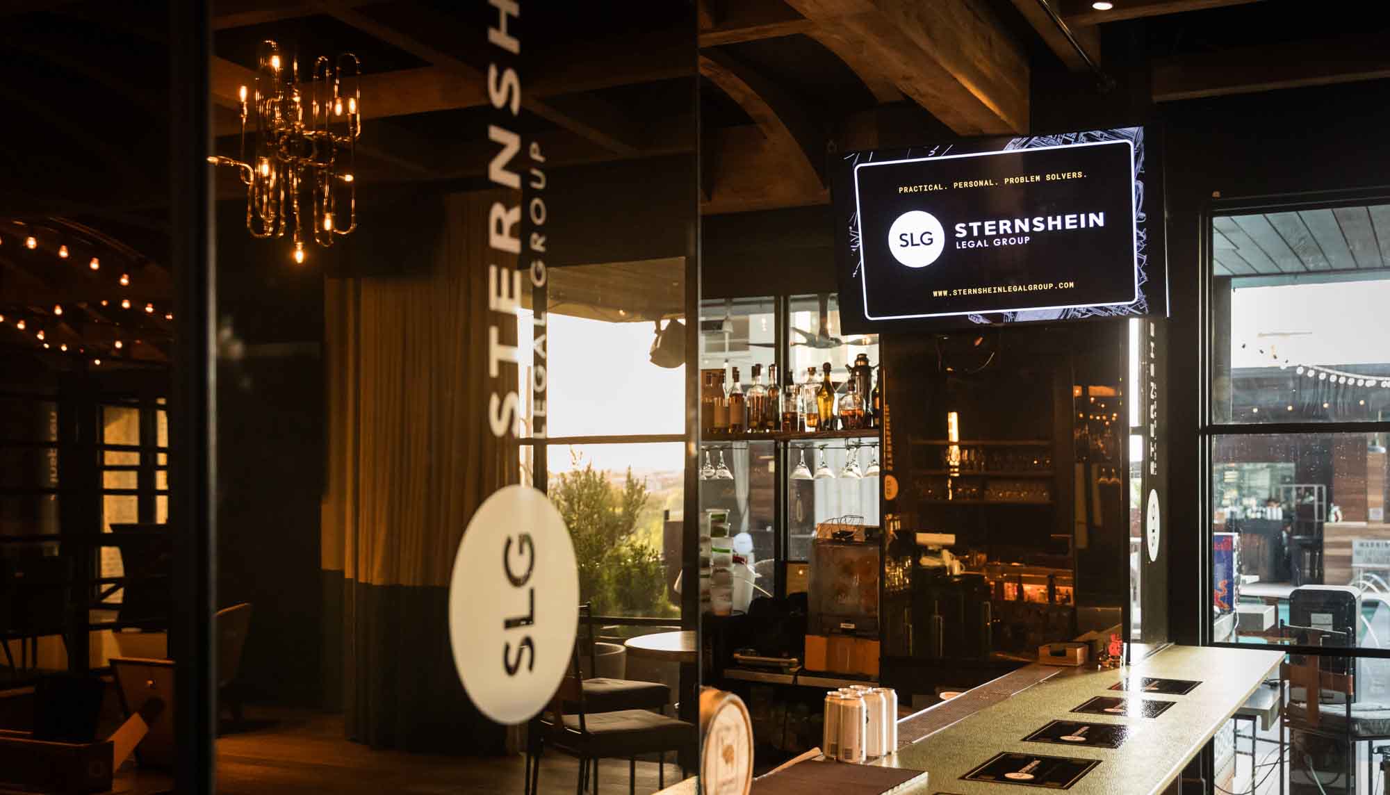 Bar with sponsor decals during a Hotel Van Zandt corporate event