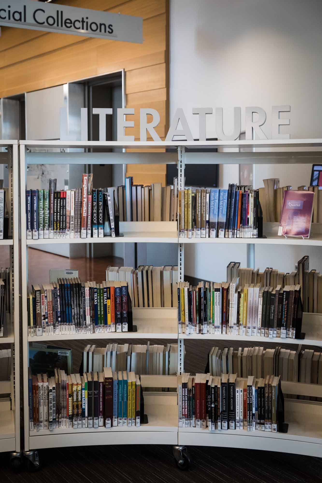 Bookshelf with the word 'Literature' in raised letters on top of the bookshelf in the Austin Central Library