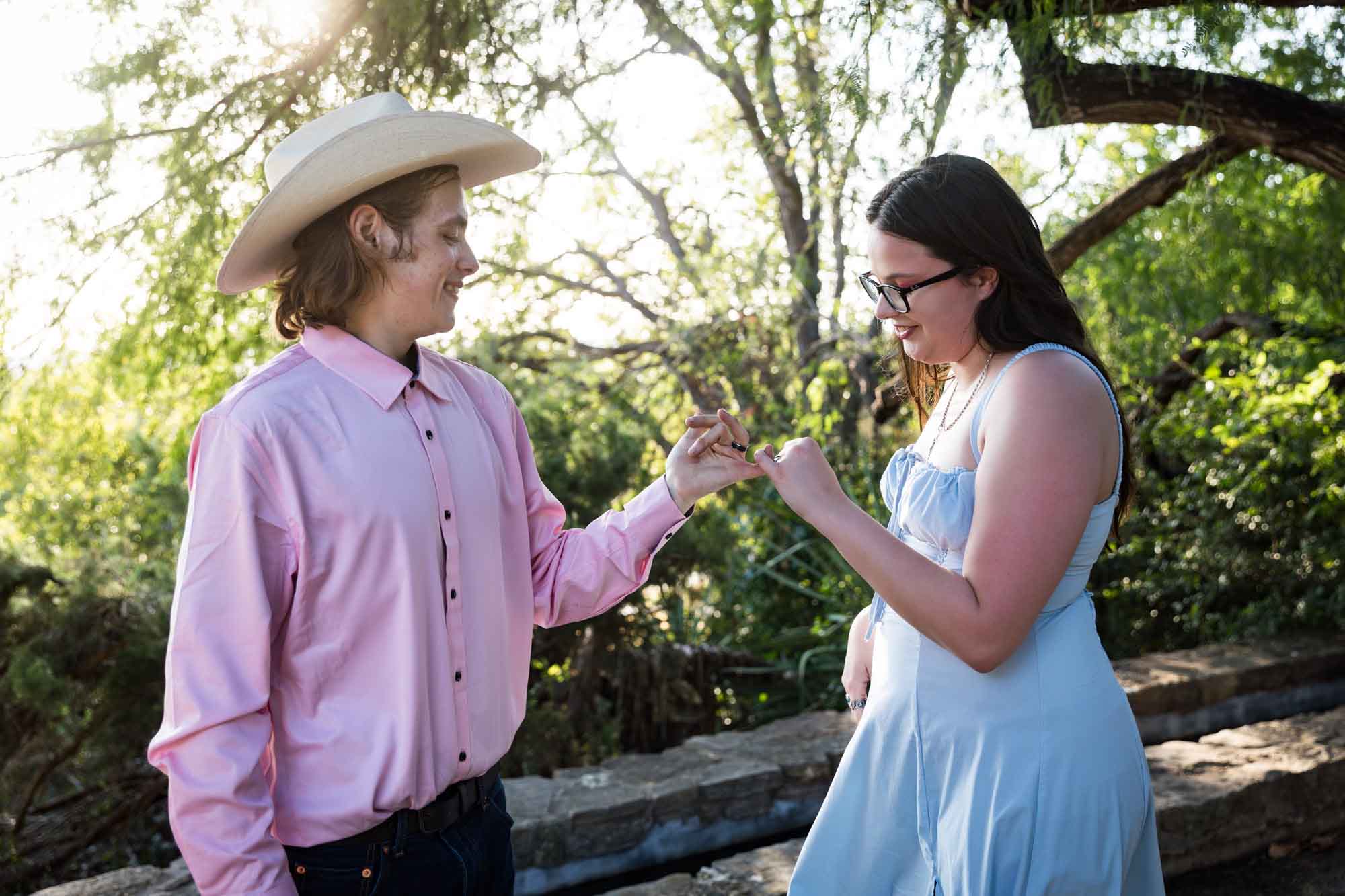 San Antonio Botanical Garden engagement photos of couple grasping pinky fingers