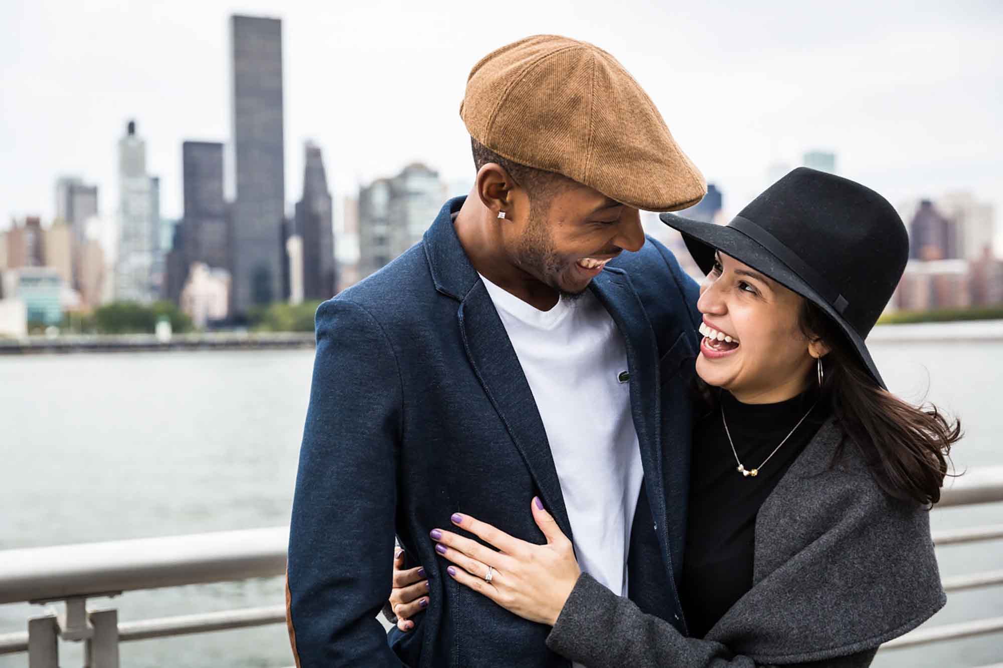 African American man and white woman hugging during engagement session