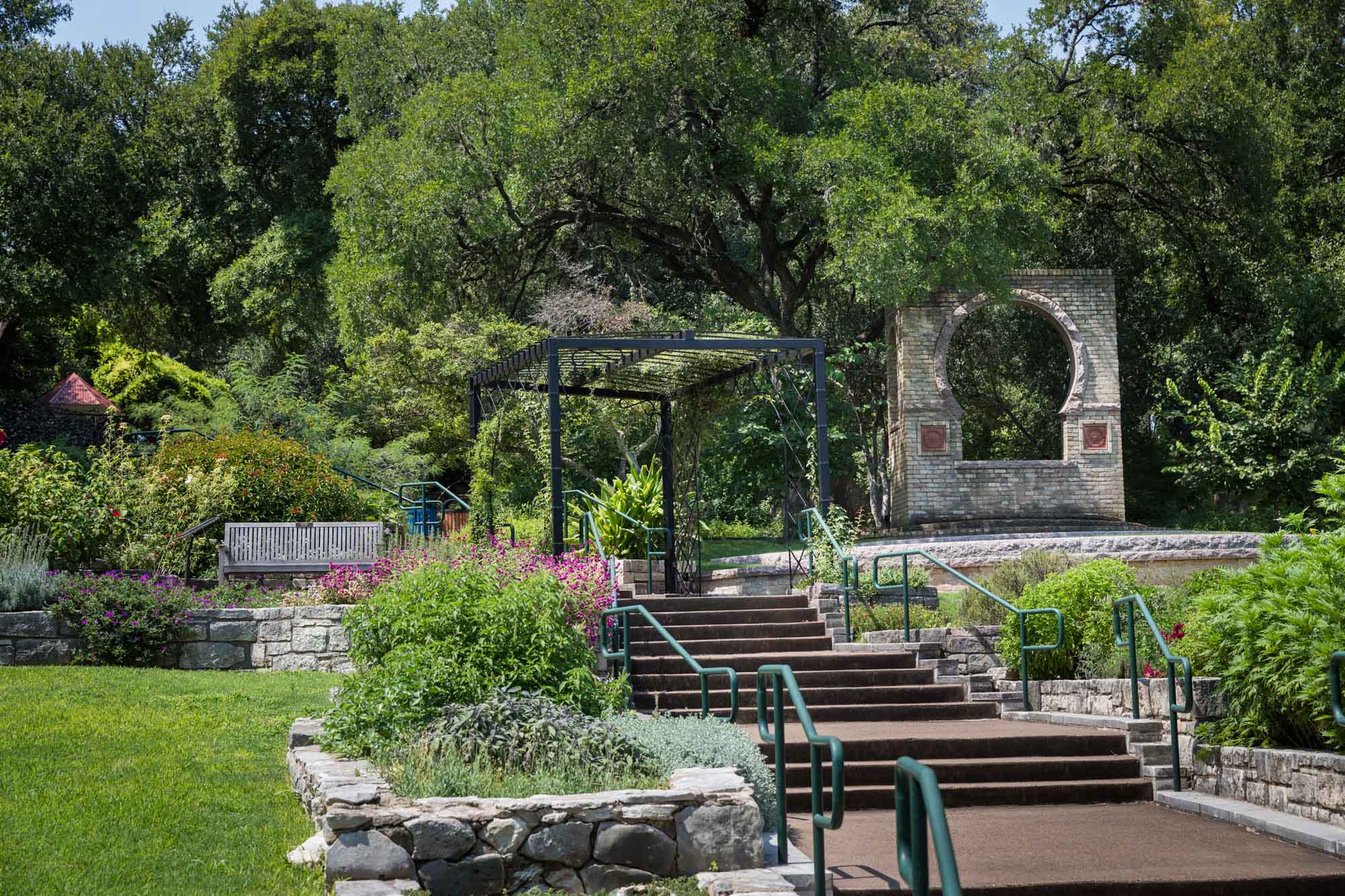 Stairway and black metal gazebo in rose garden at Zilker Botanical Garden for an article on the best places to propose in Austin