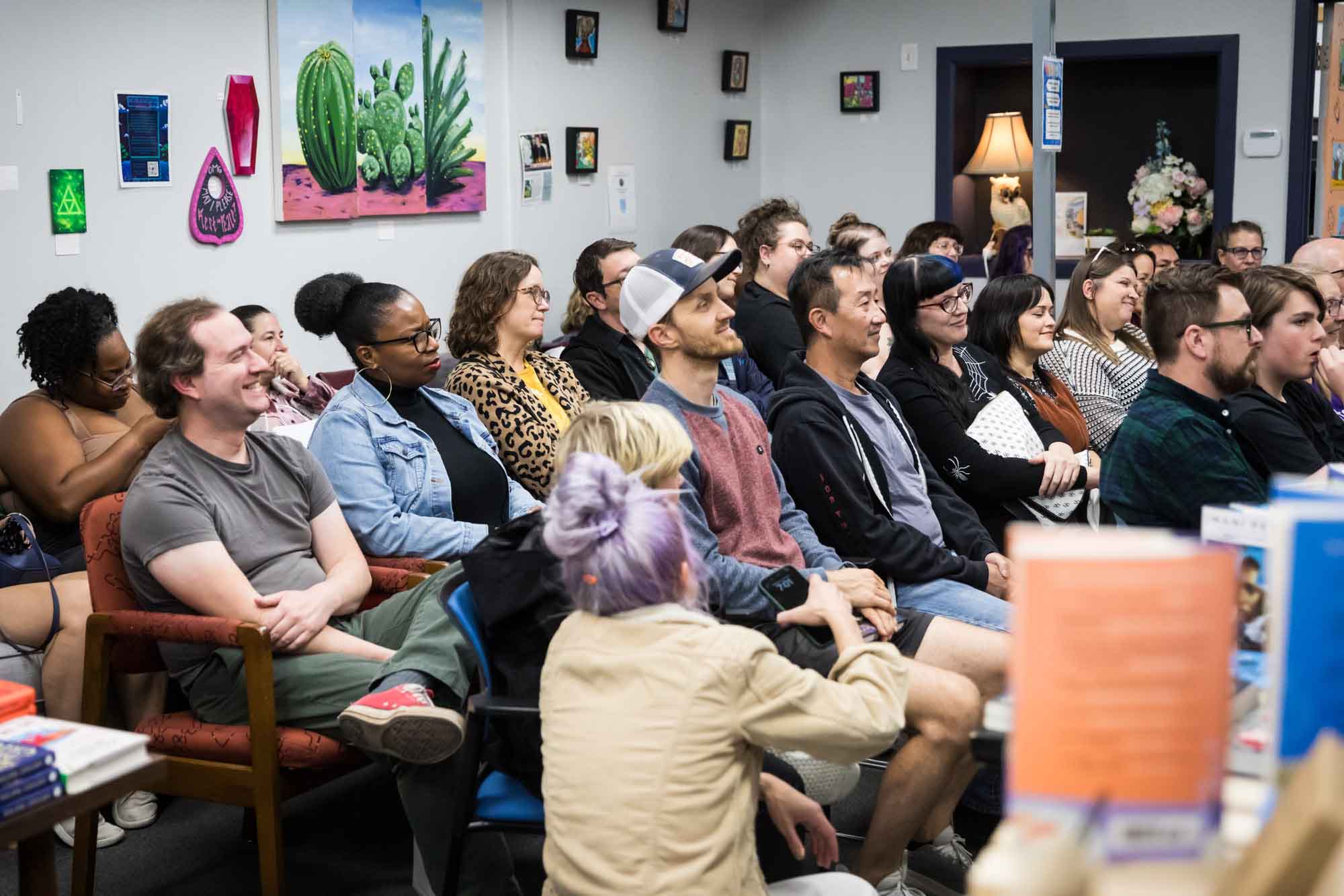 Austin book launch party photos of guests seated and listening at Birdhouse Books