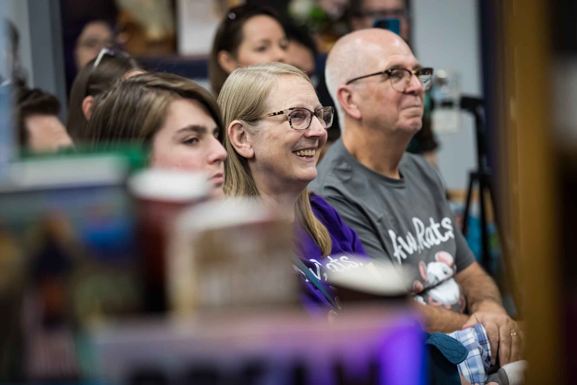 Austin book launch party photos of guests seated and listening at Birdhouse Books