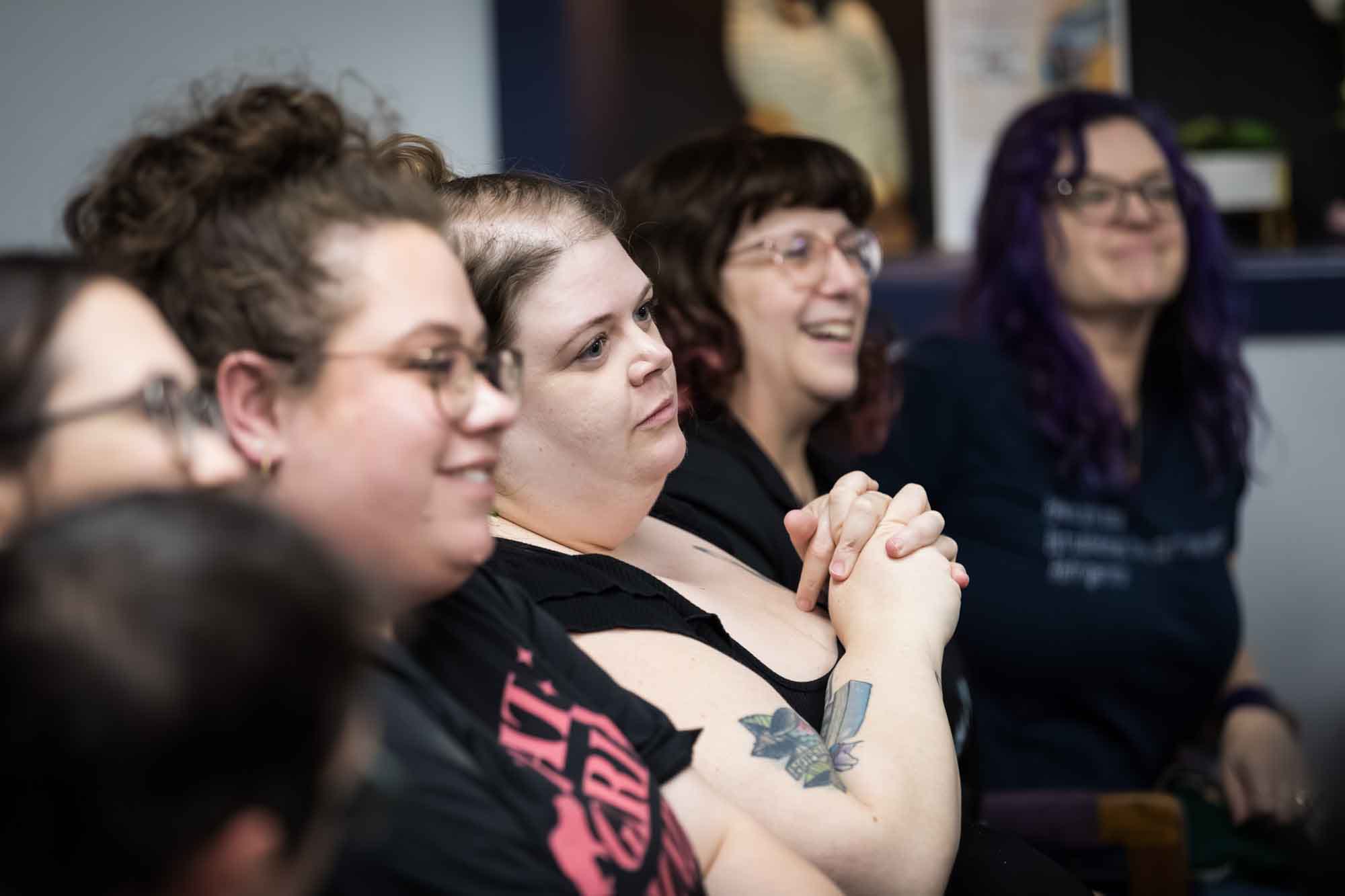 Austin book launch party photos of guests seated and listening at Birdhouse Books