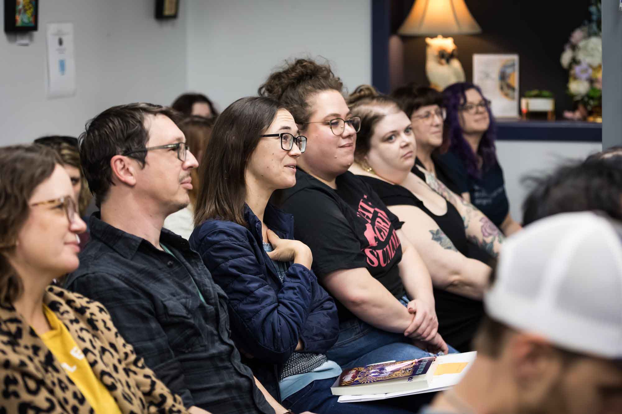 Austin book launch party photos of guests seated and asking questions at Birdhouse Books