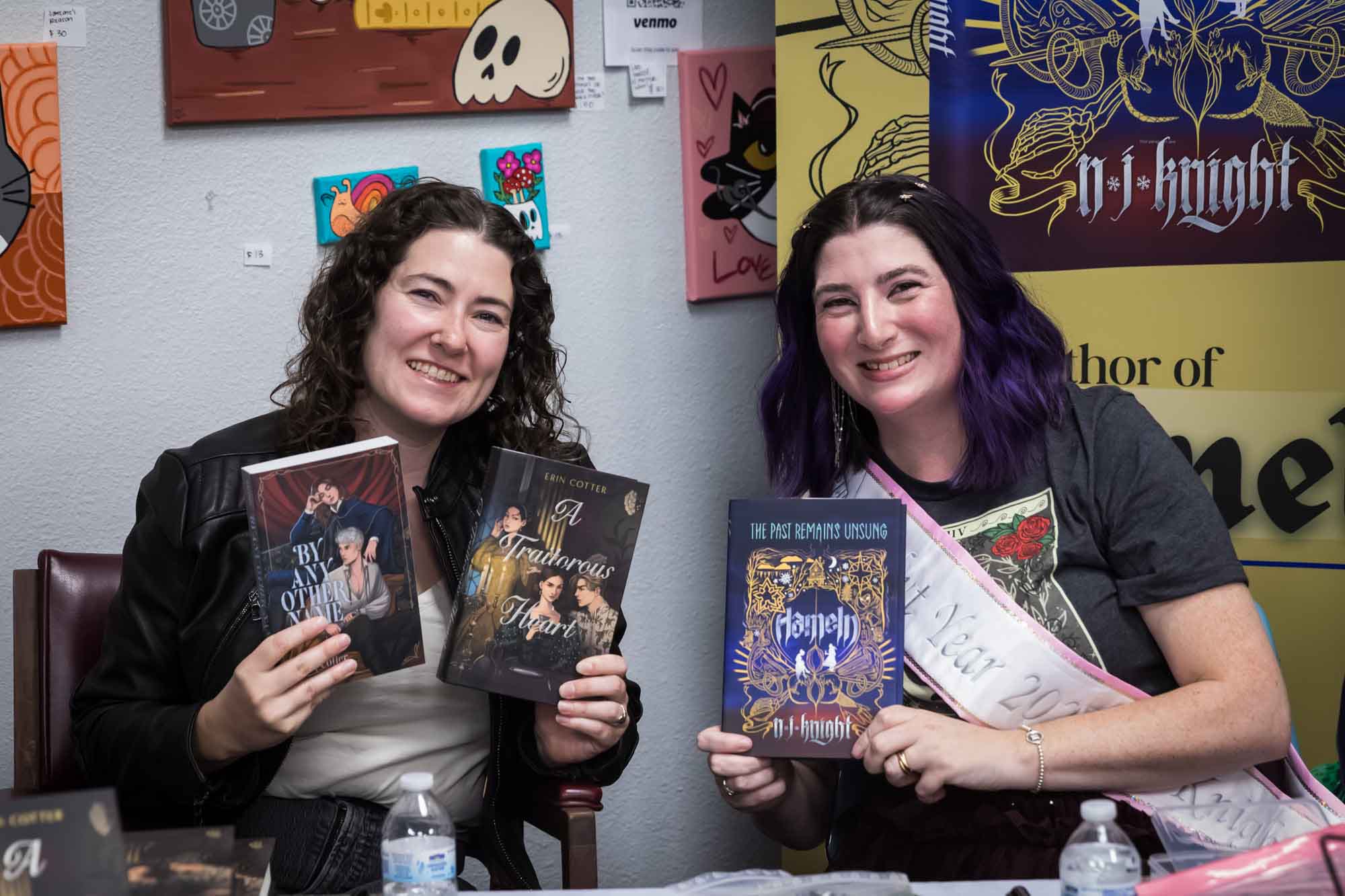 Austin book launch party photos of authors Erin Cotter and Nancy Knight holding up books